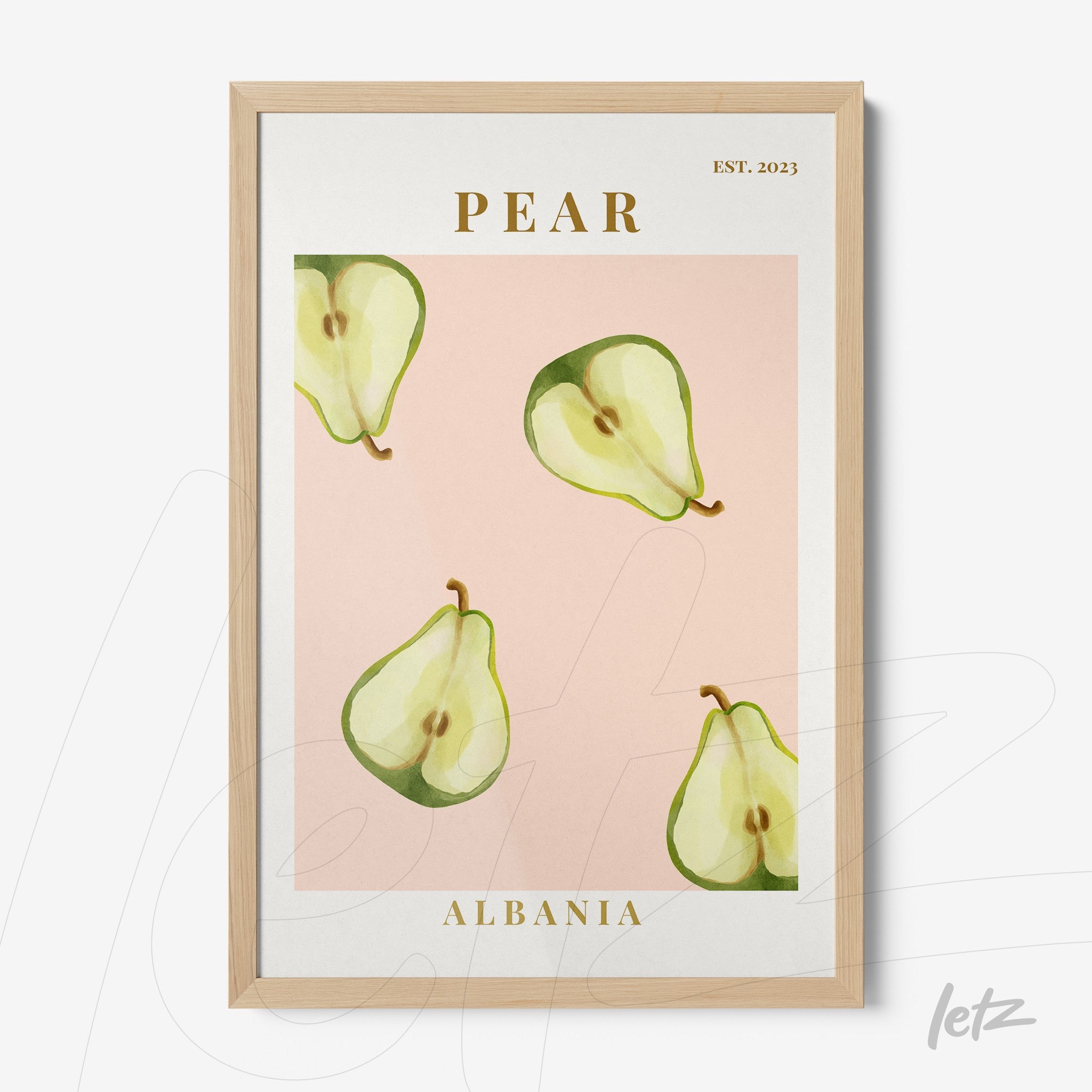 framed wall art featuring slices of pear on a pink background with light wood frame