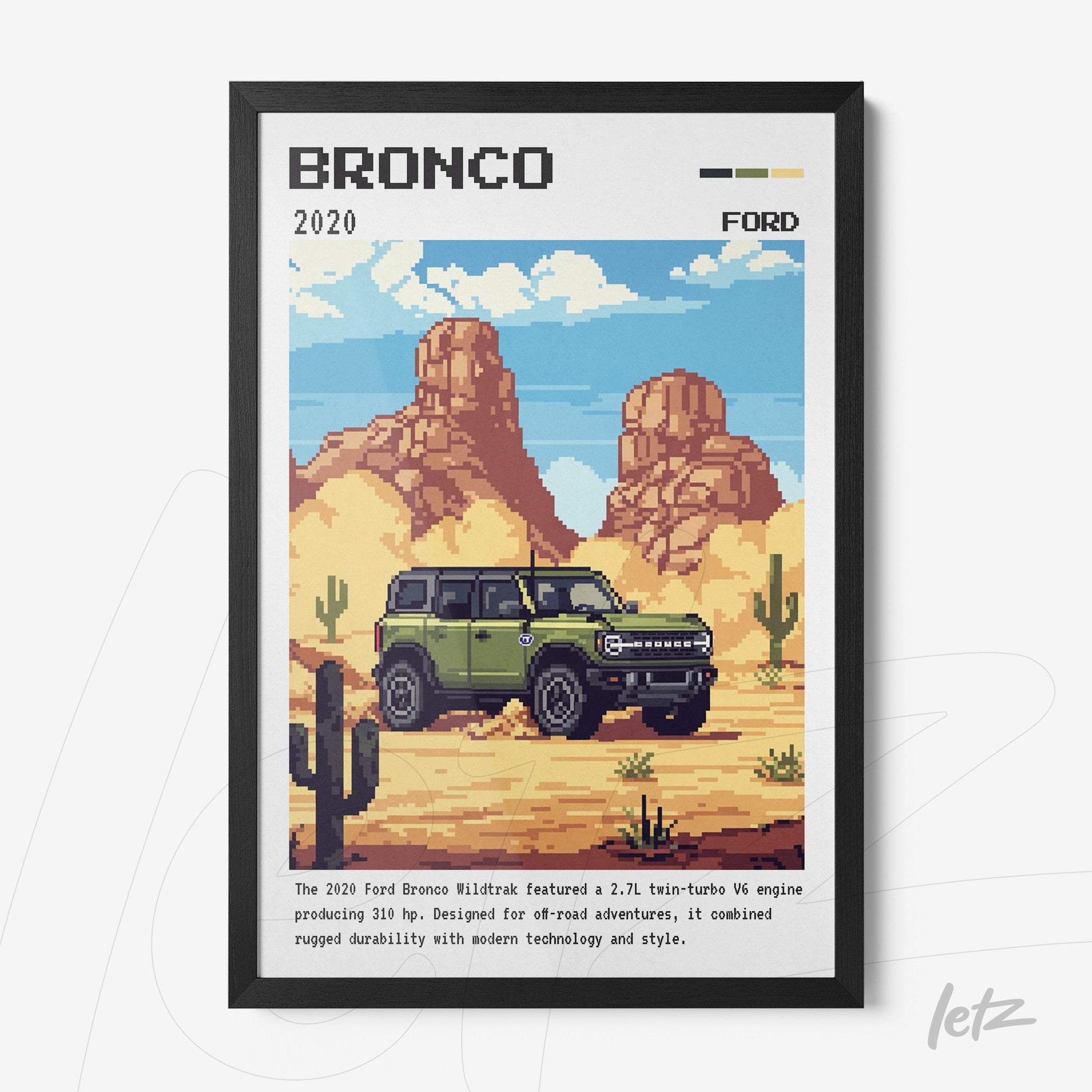 pixel art wall decor of the 2020 Ford Bronco in black frame, desert scene with mountains in the background and cacti