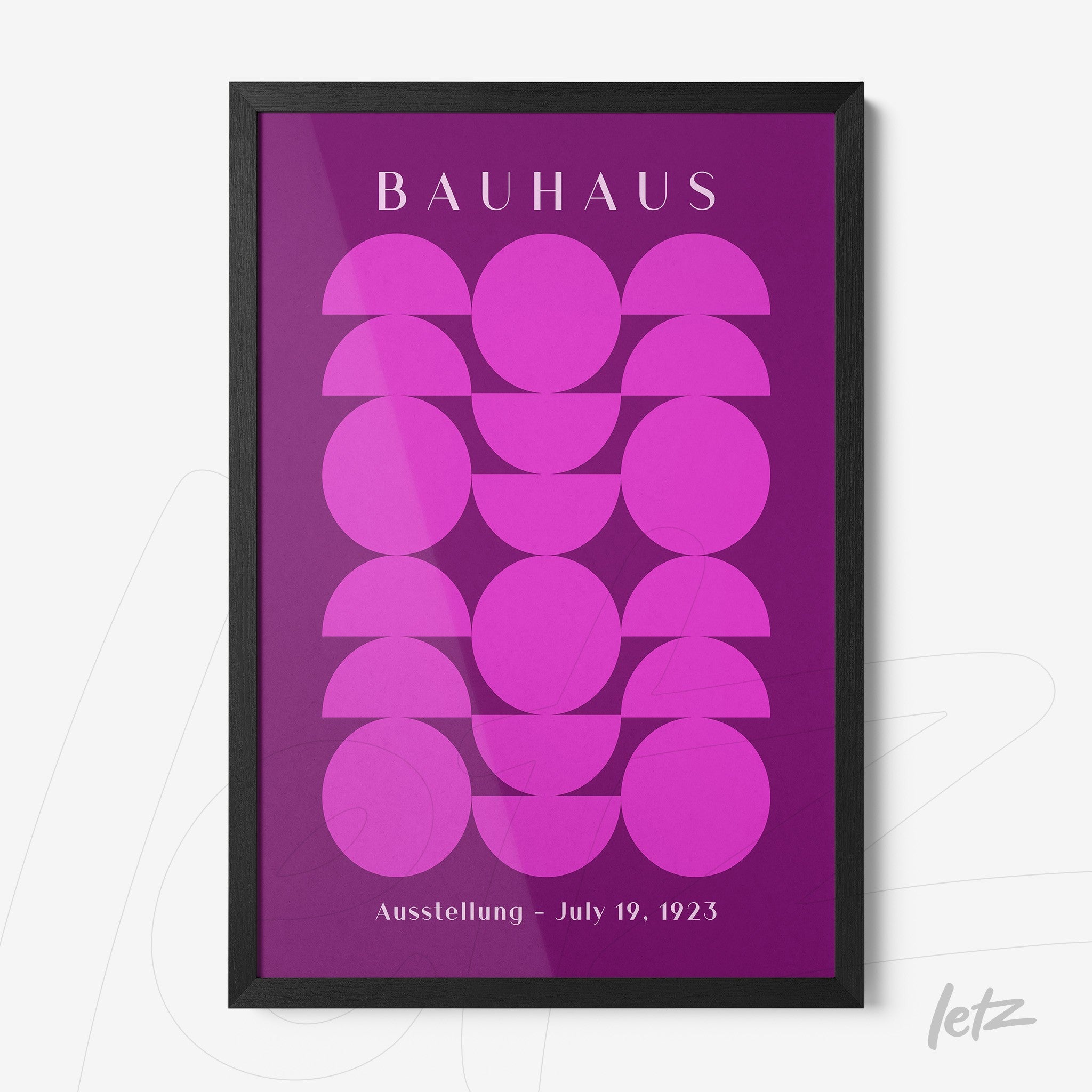 poster with geometric design in pink and purple with black frame