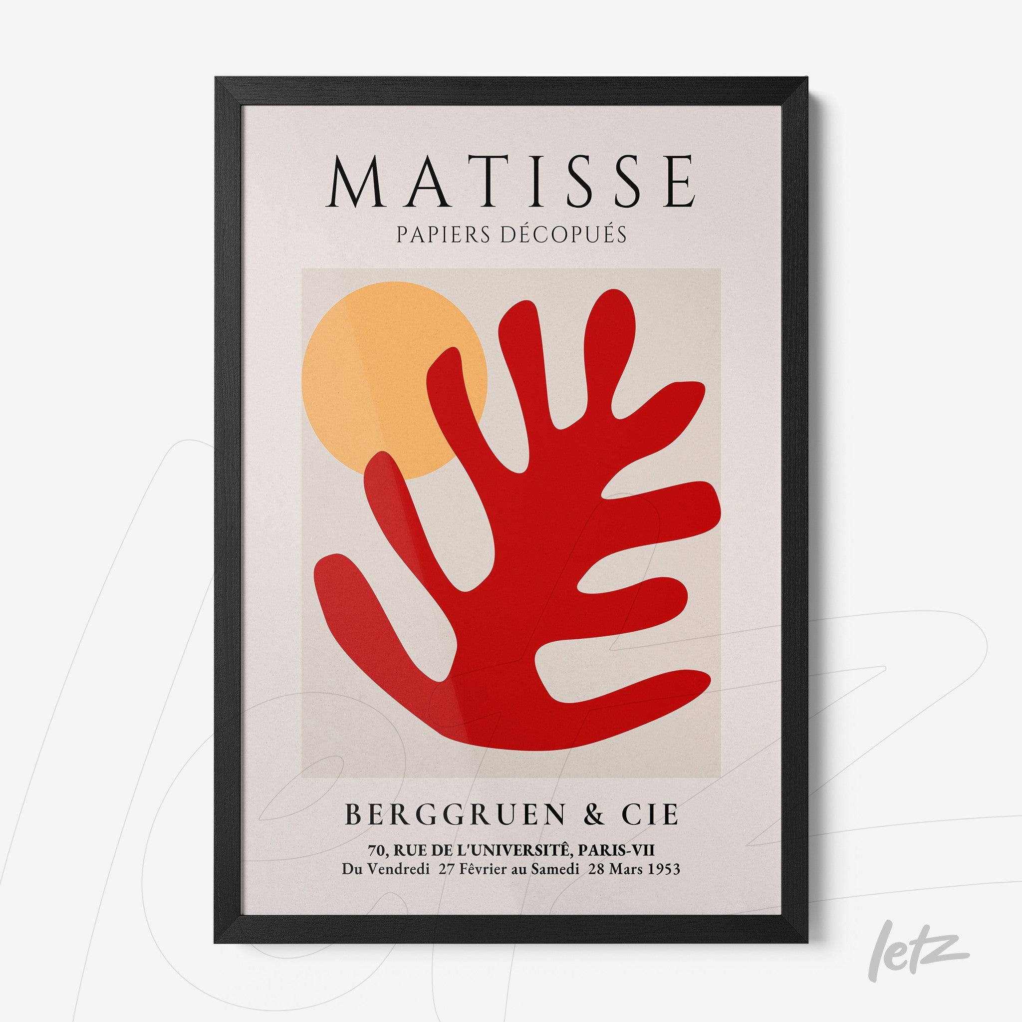 framed artwork featuring modern art in vibrant colors, showcasing geometric shapes and a stylized red leaf on a light background, black frame
