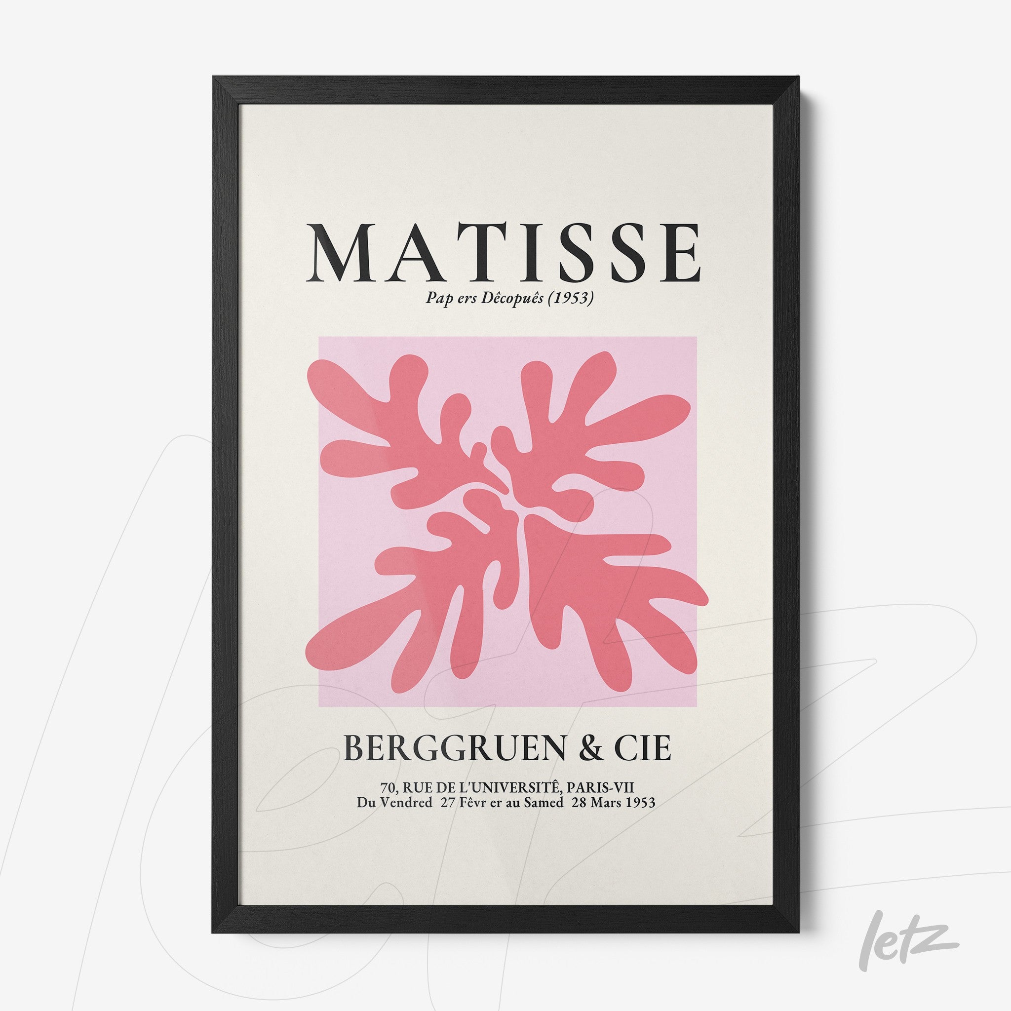 framed modern art featuring organic shapes in pink tones on a pastel background with black frame