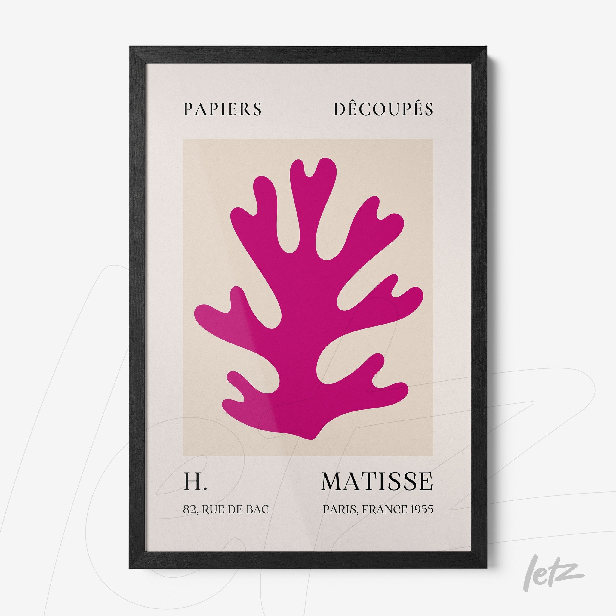 framed wall art featuring a stylized pink plant silhouette on a light background