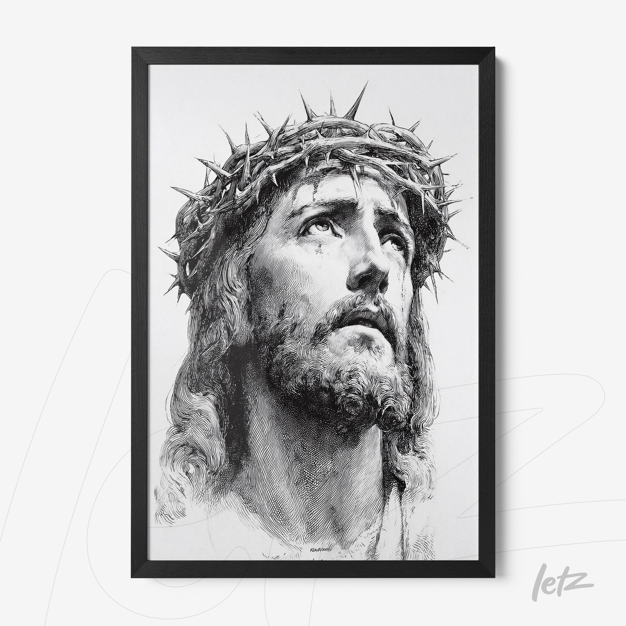 framed black and white portrait of Jesus Christ wearing a crown of thorns
