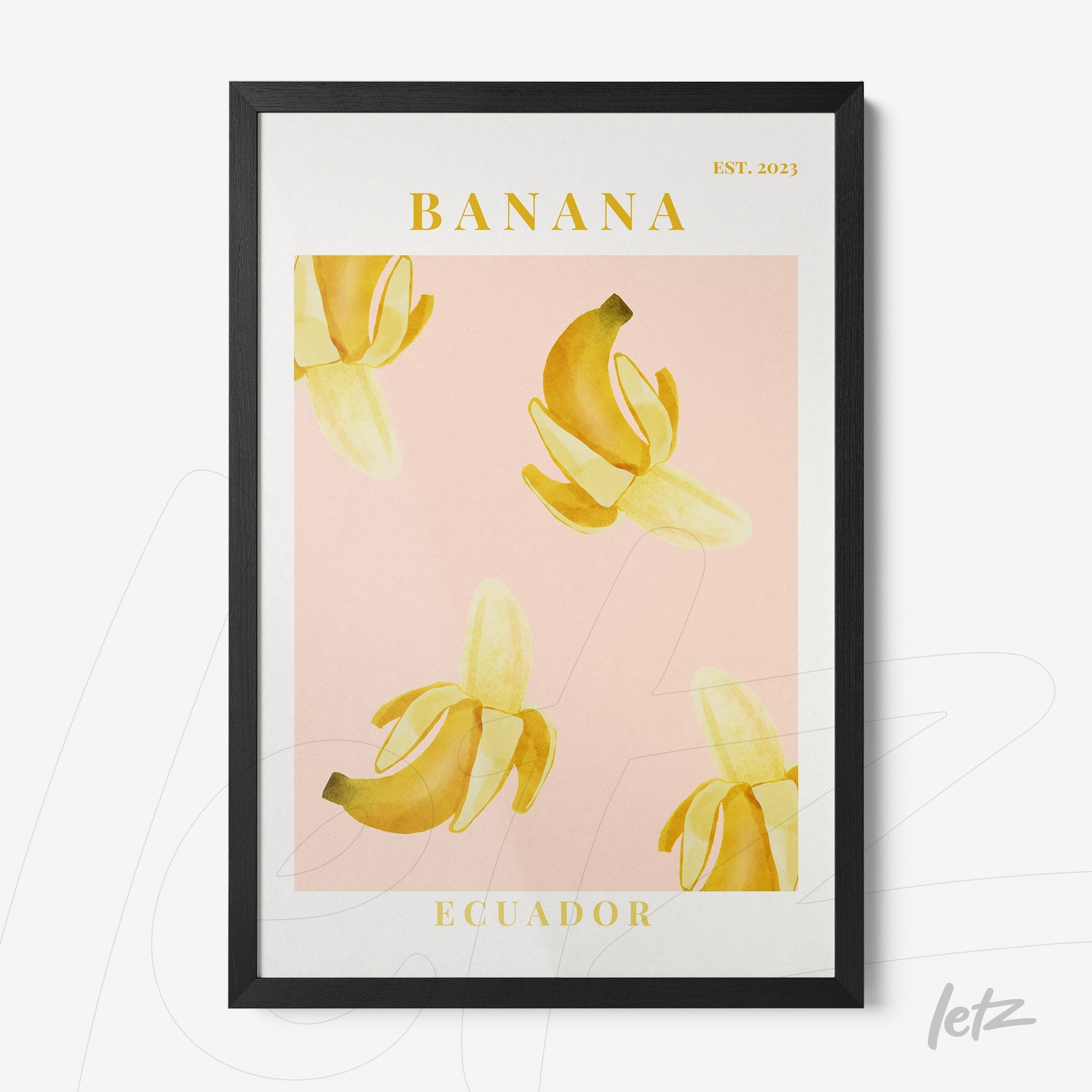 framed wall art featuring banana illustration on pink background with black frame
