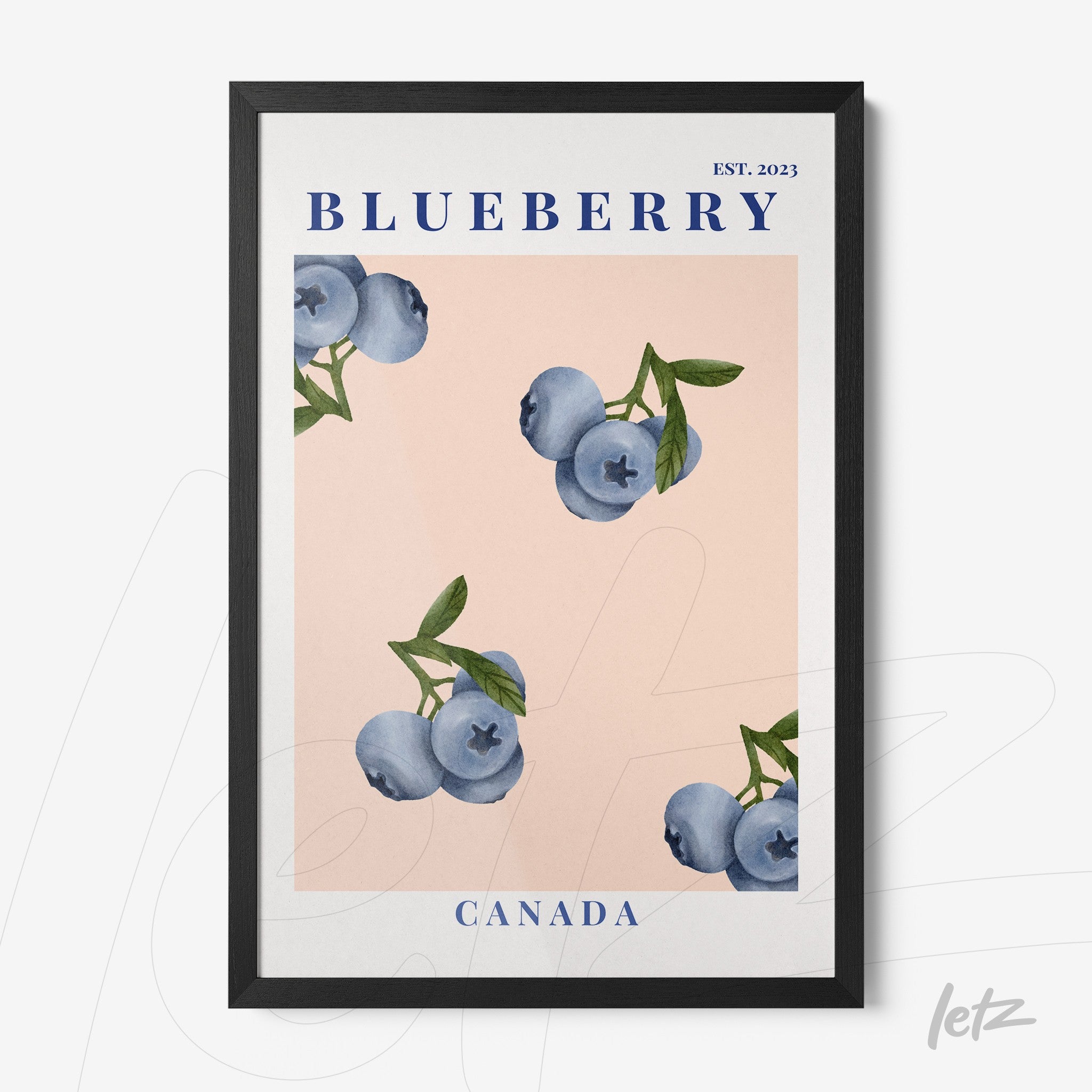 framed wall art featuring blueberries on a light pink background with a black frame