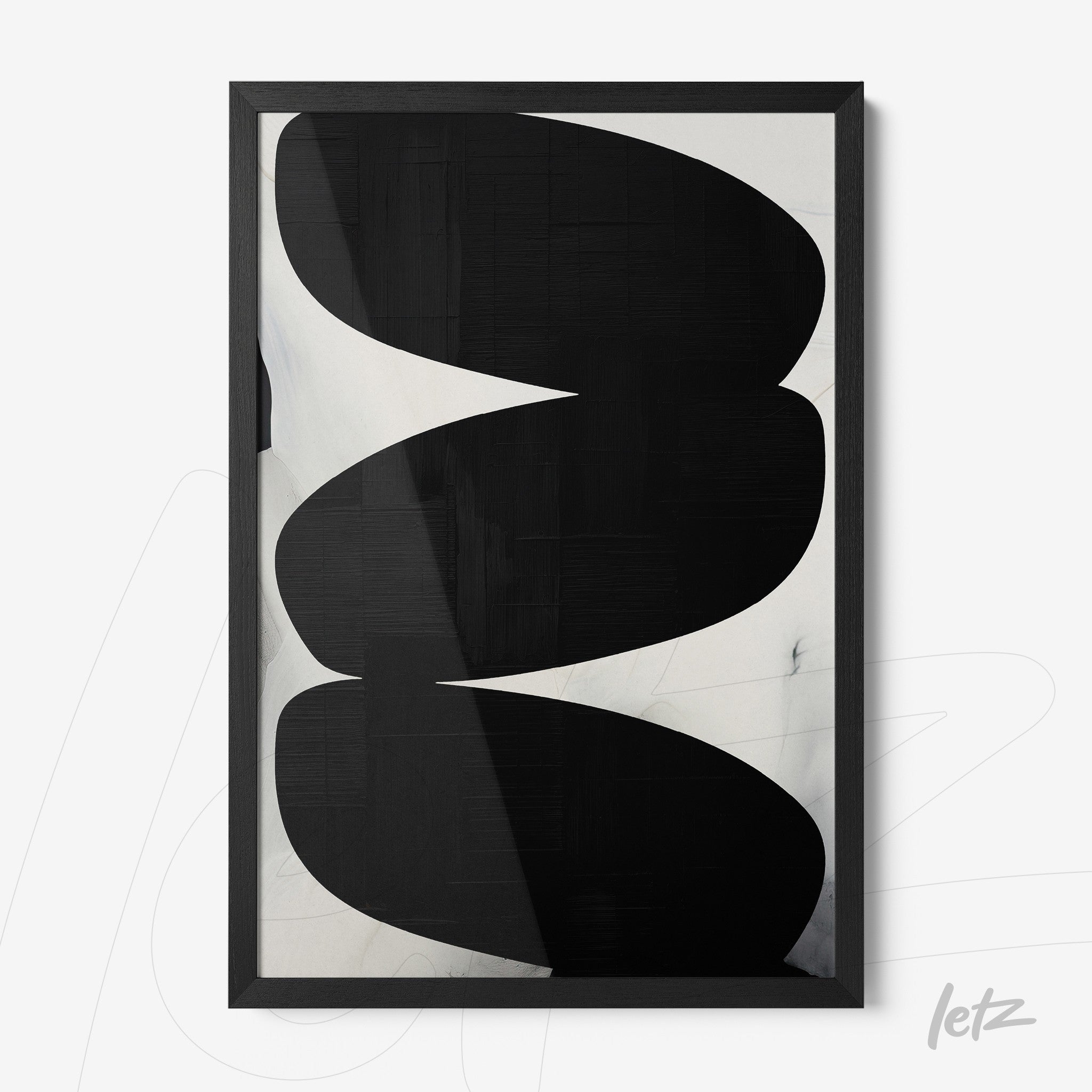 framed modern art piece in black and white featuring curved shapes and black frame