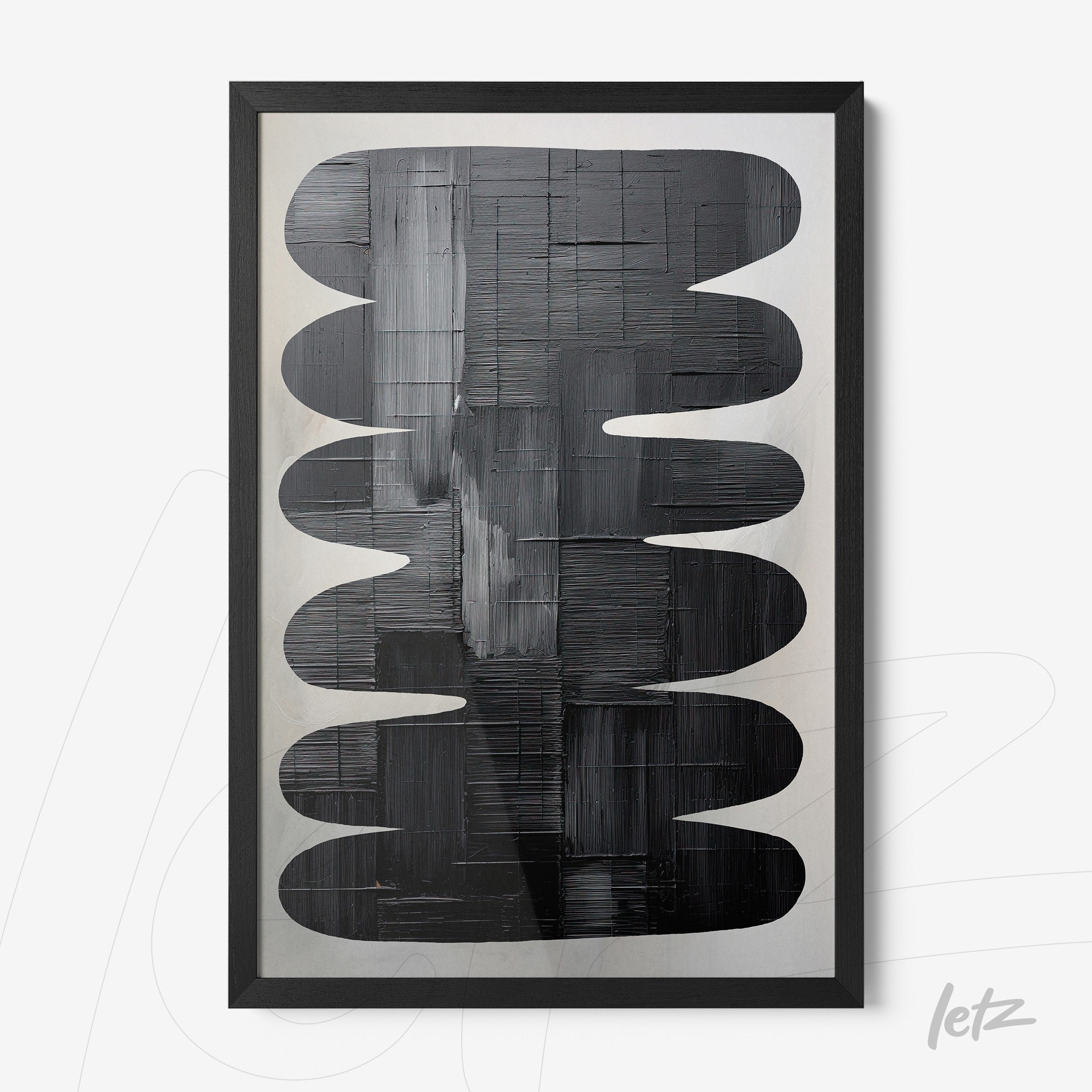 abstract wall art in shades of black and gray, framed in a matte black frame