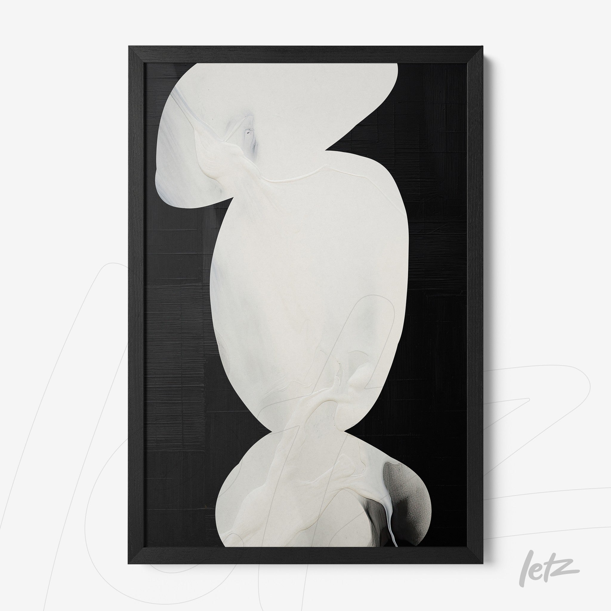 framed abstract art piece in white tones with a black background