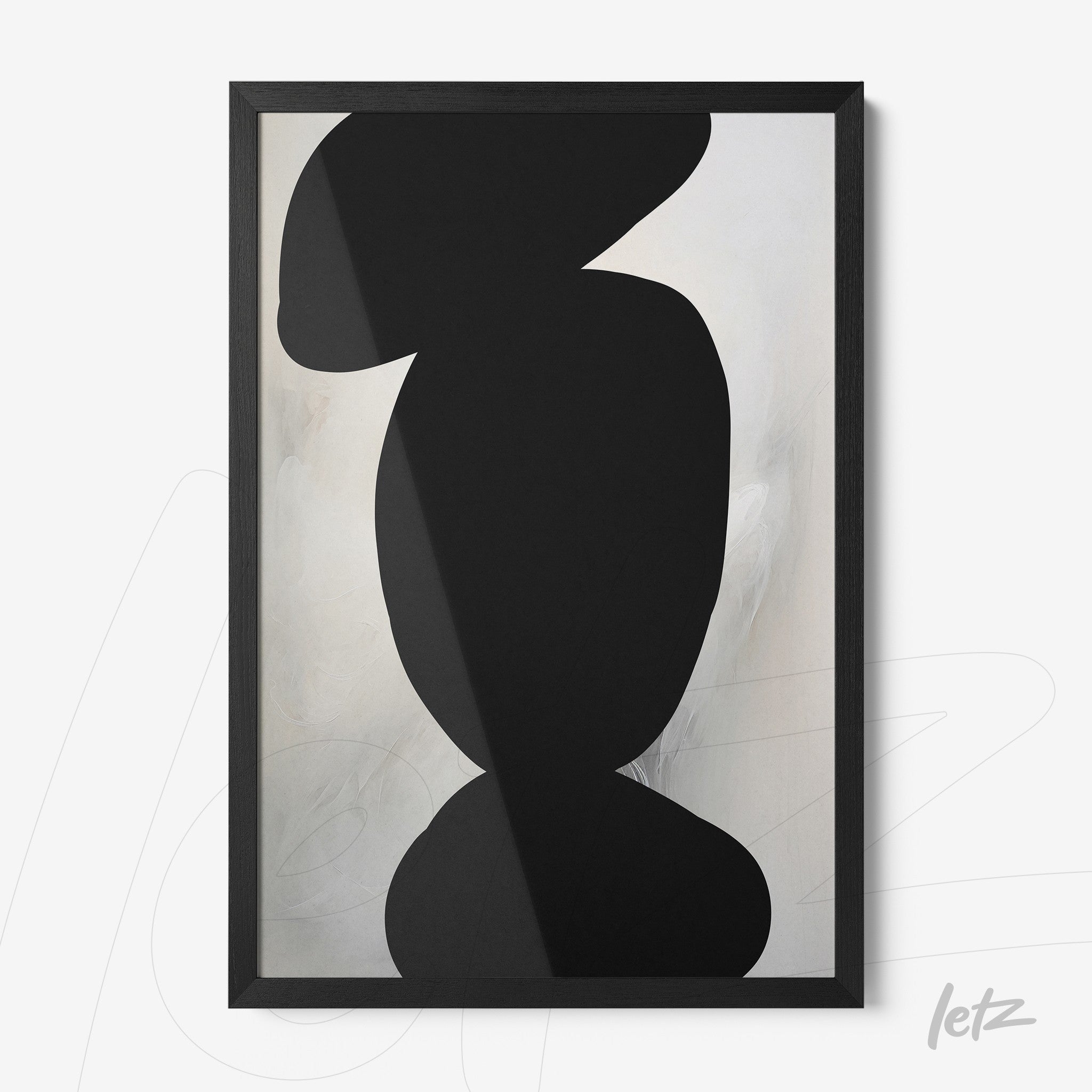 abstract wall art in black and white within a thin black frame