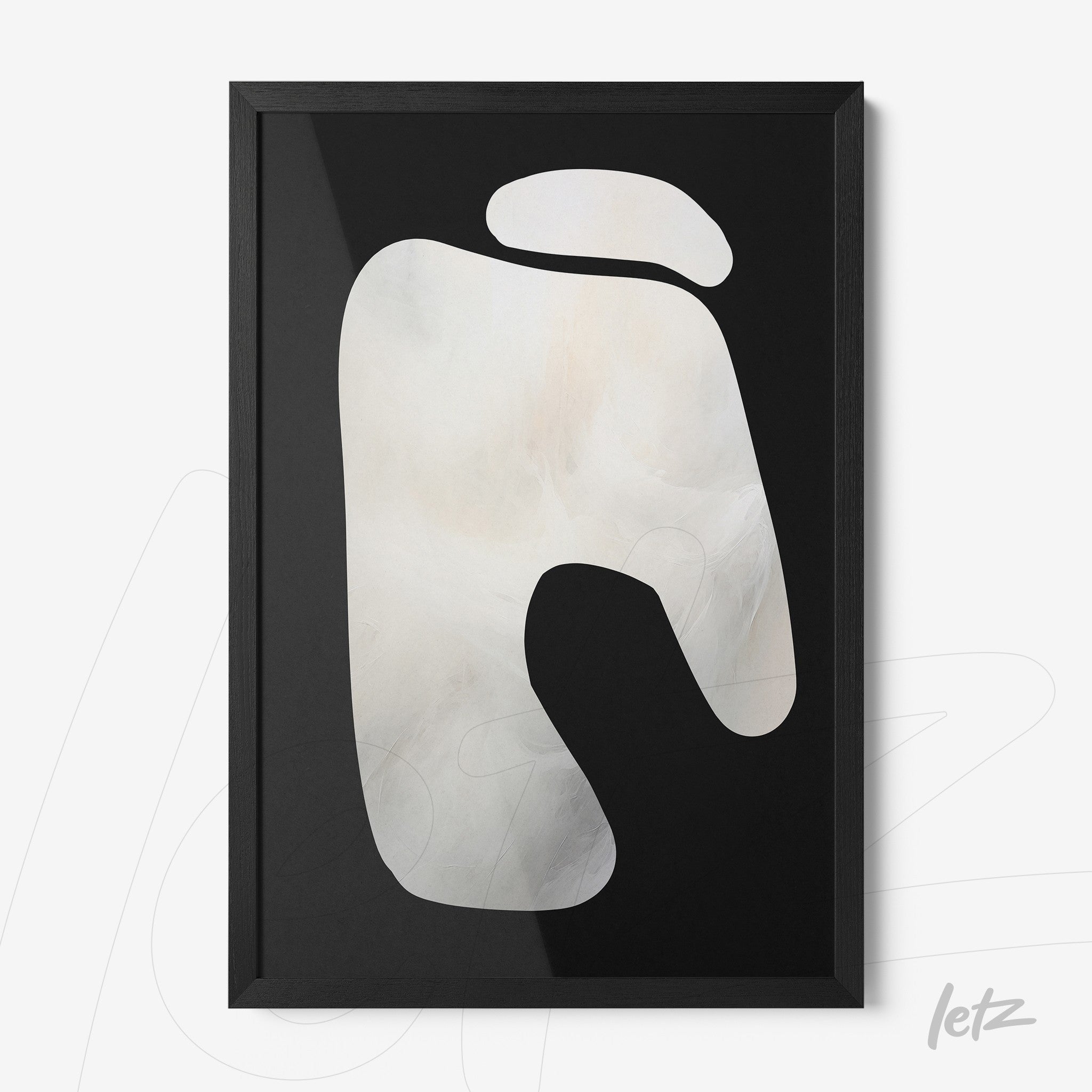 abstract wall art in light shades within a black frame