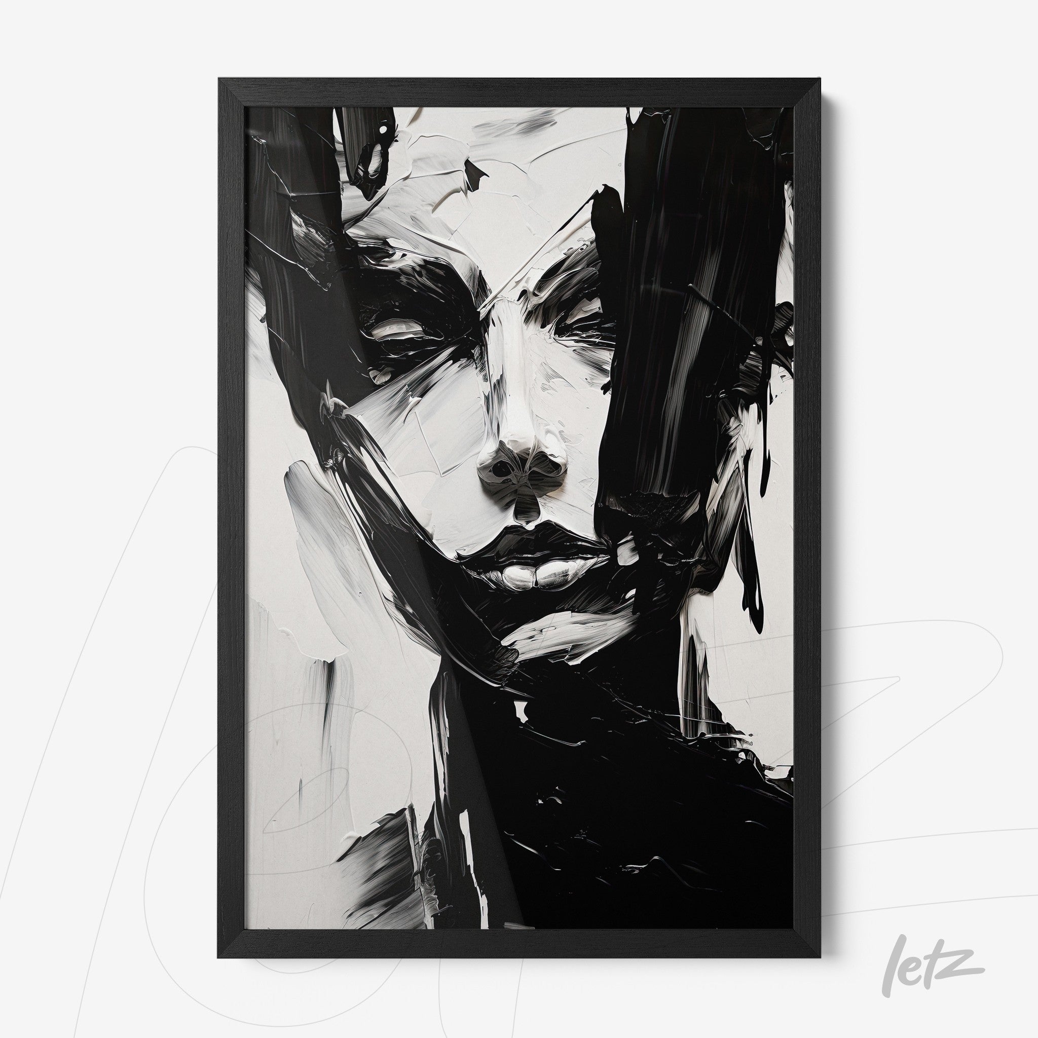 abstract wall art in black and white featuring a human face in a black frame