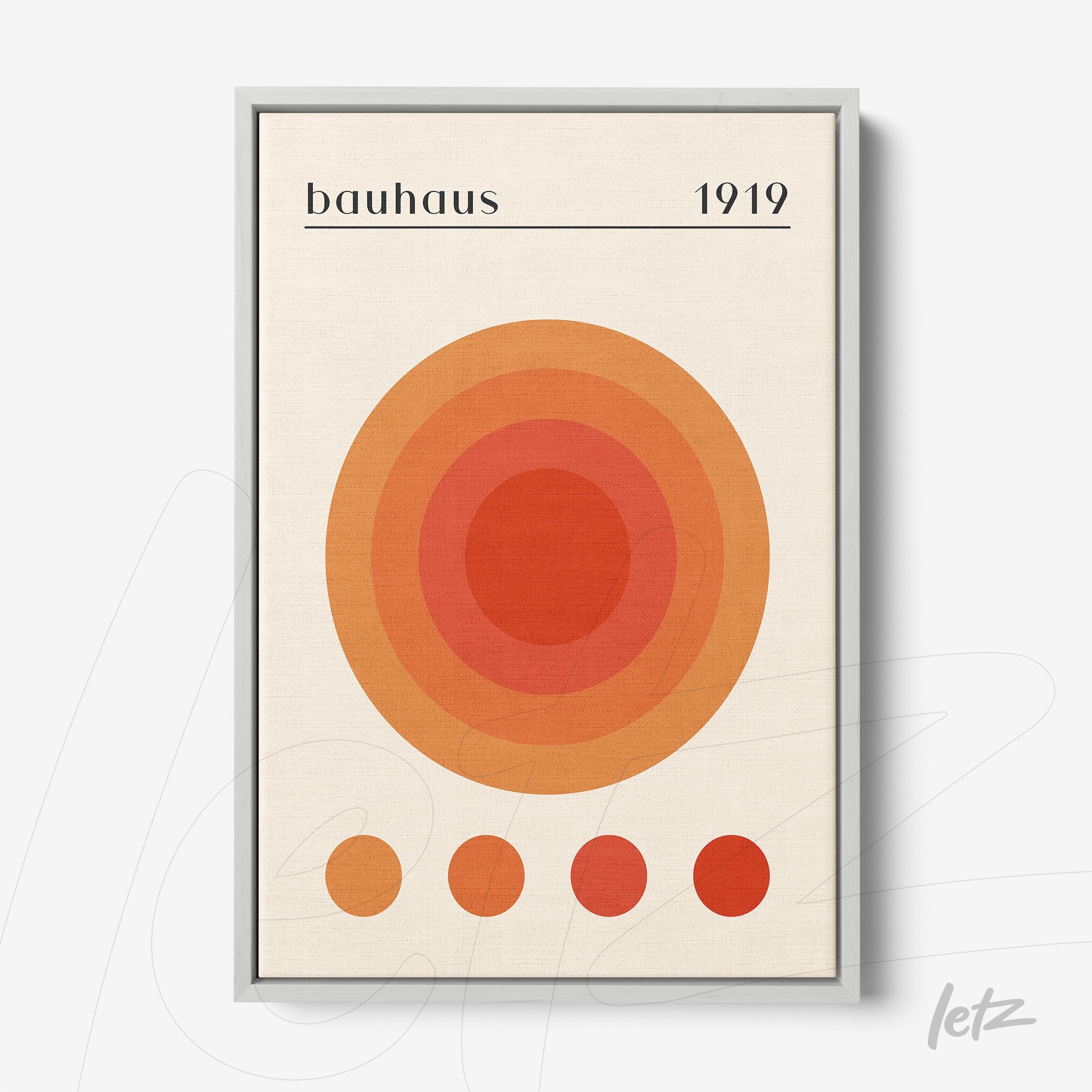 canvas print with concentric circles in orange shades with silver frame, bauhaus style