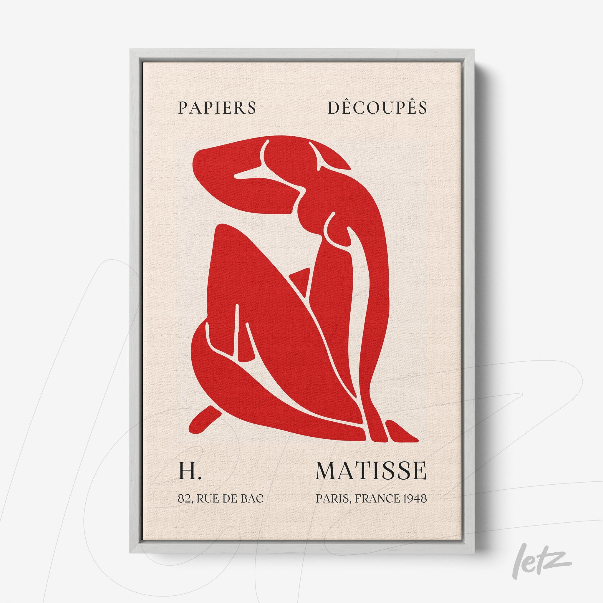 framed art featuring a cut-out red figure on a light background with a silver frame