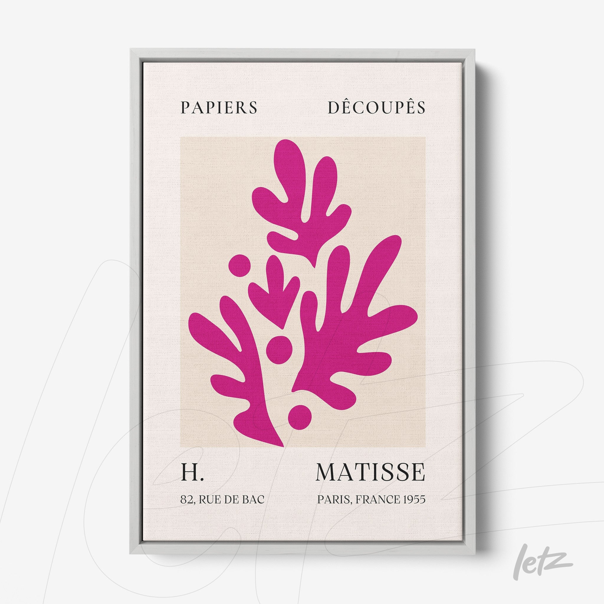 abstract wall art featuring pink leaves in a silver frame with a neutral background