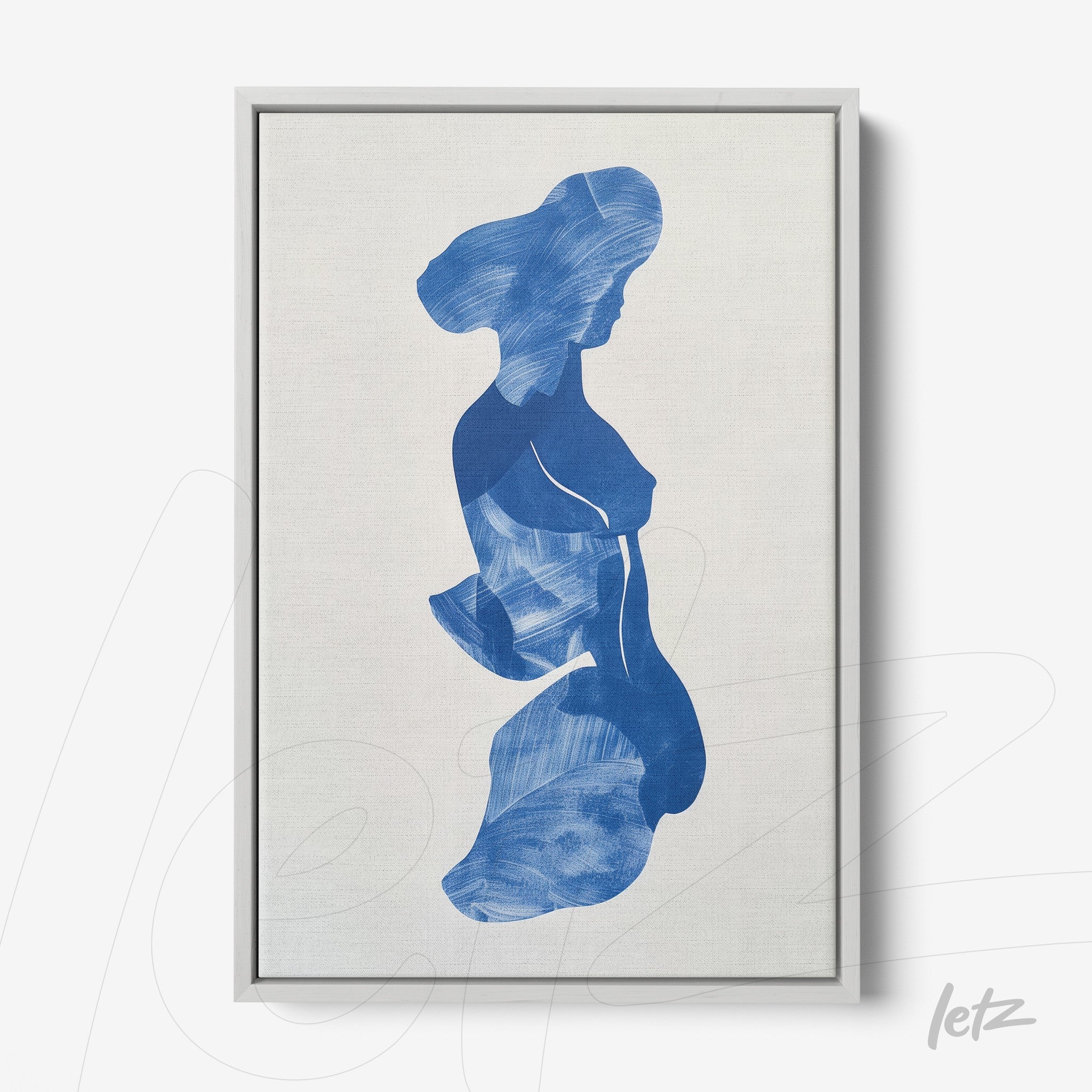 framed wall art featuring an abstract blue silhouette of a woman with a silver frame