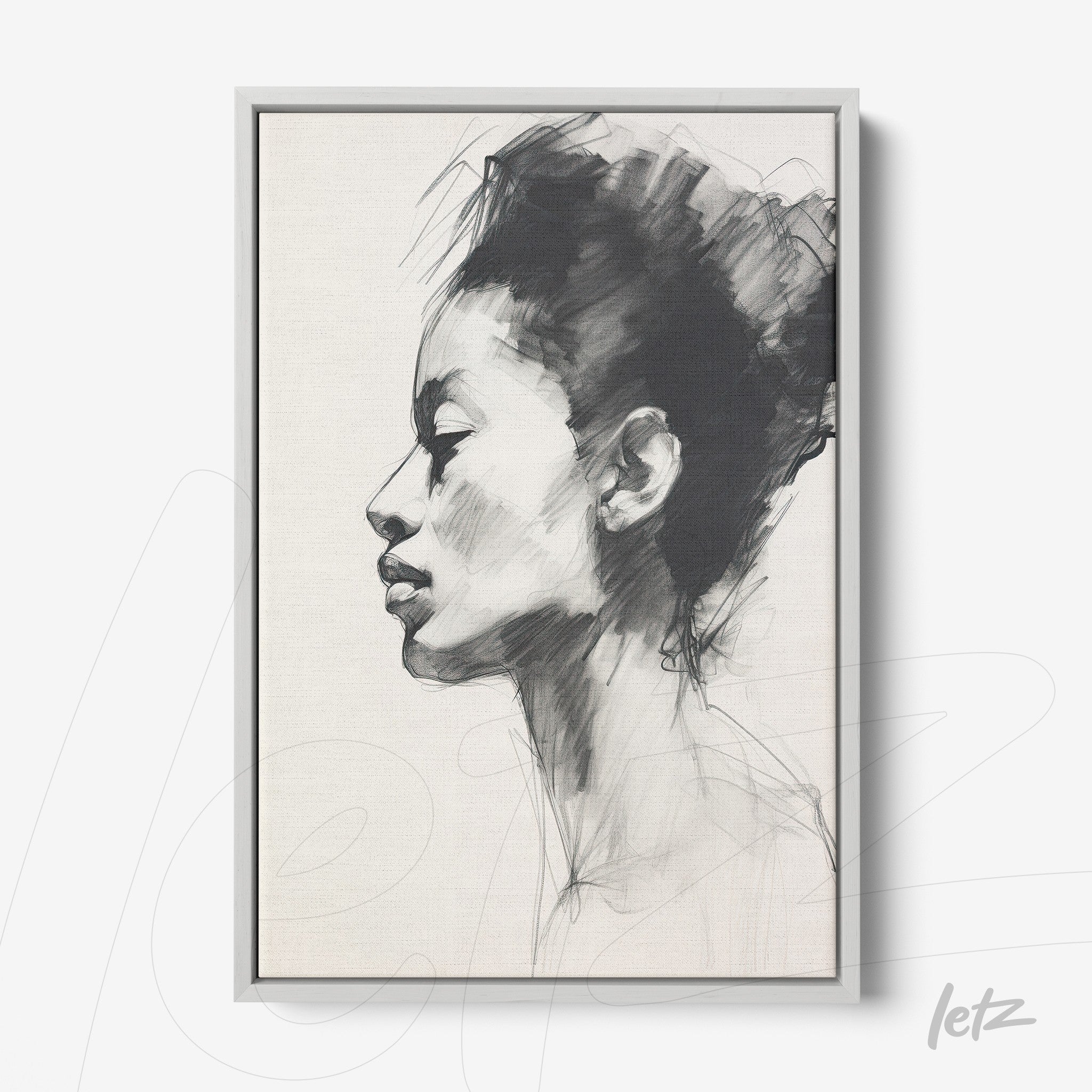 framed wall art featuring a charcoal sketch of a female profile in silver frame