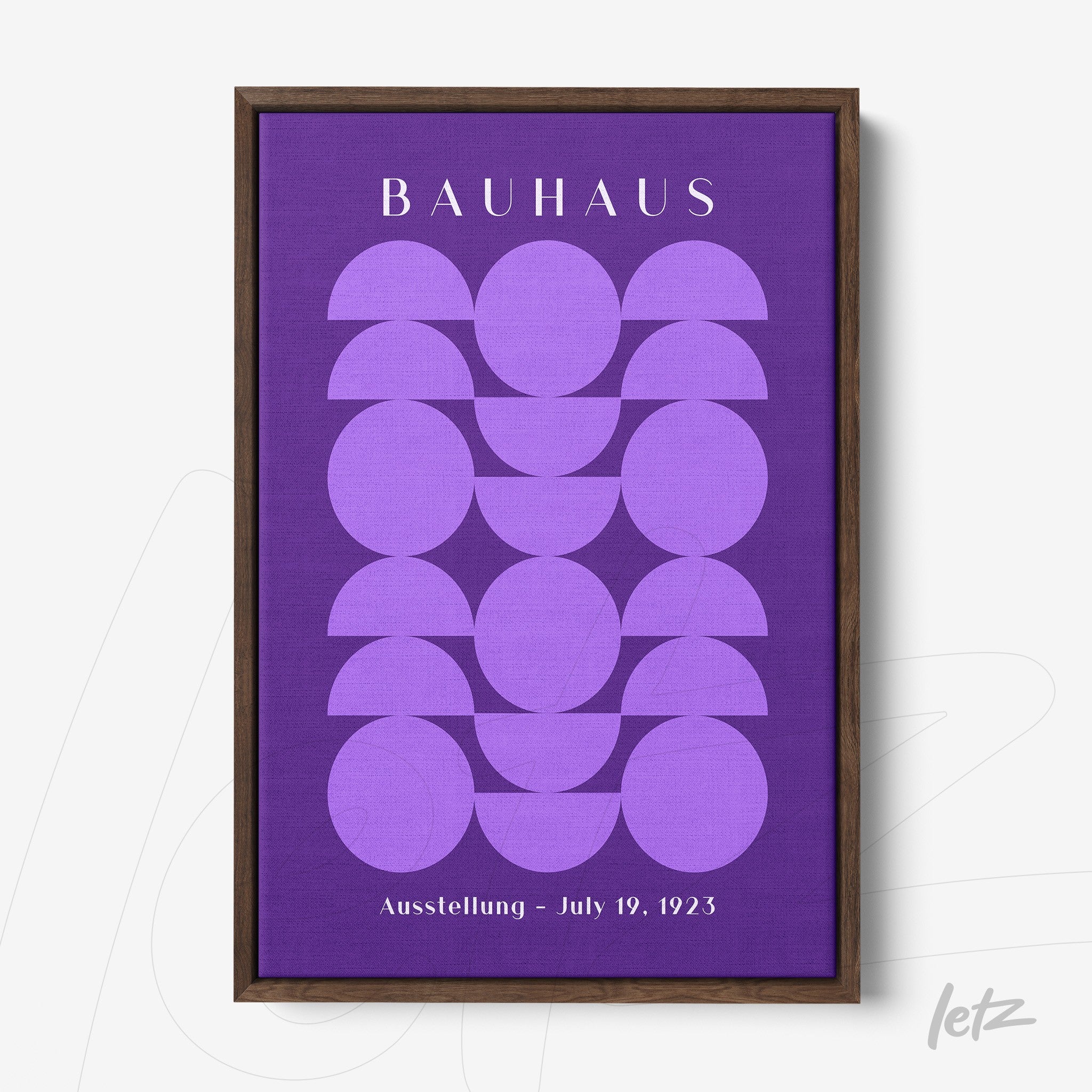 geometric design wall art in shades of purple with 'Bauhaus' text in dark wood frame