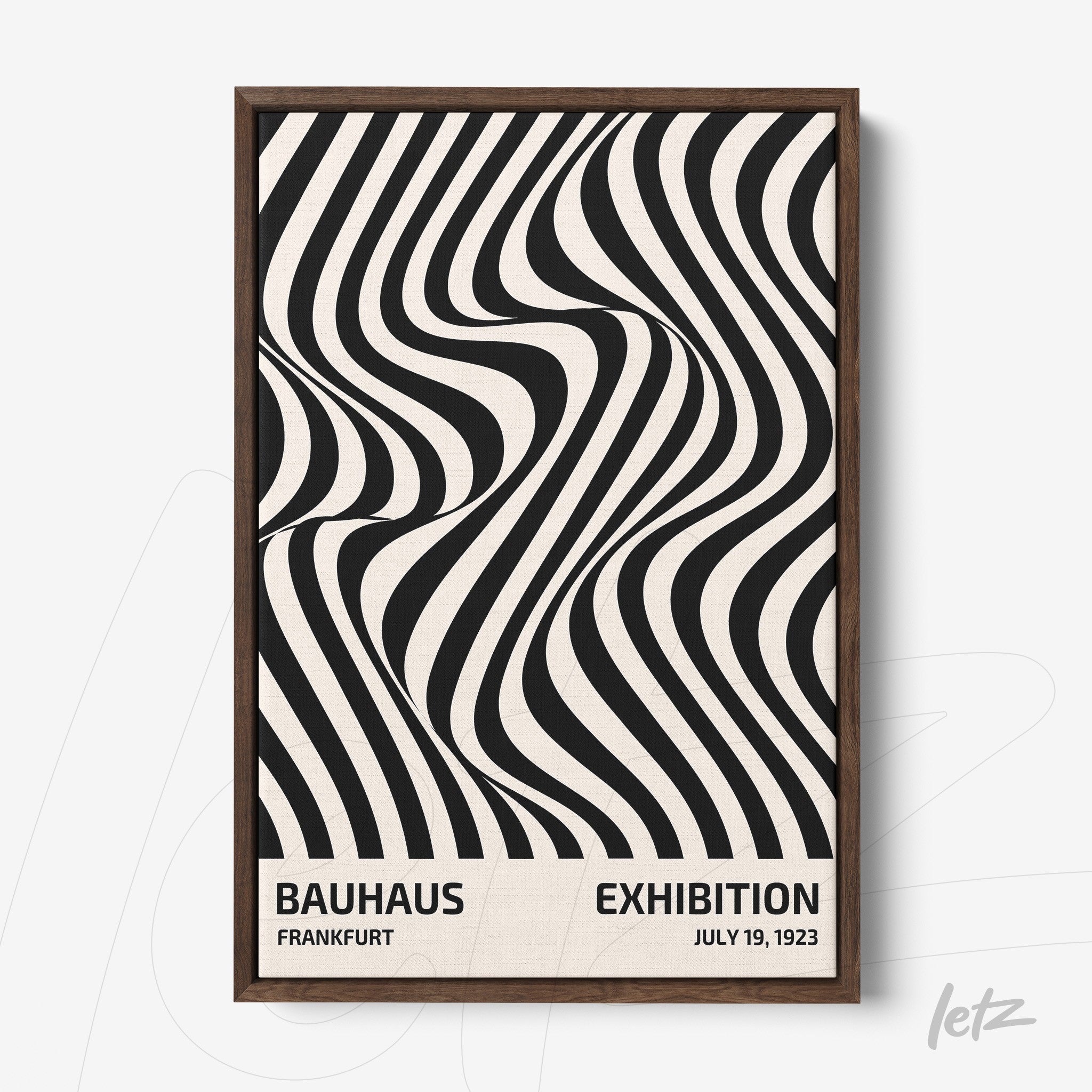 framed poster in black and white op art style featuring text about Bauhaus exhibition with dark wood frame