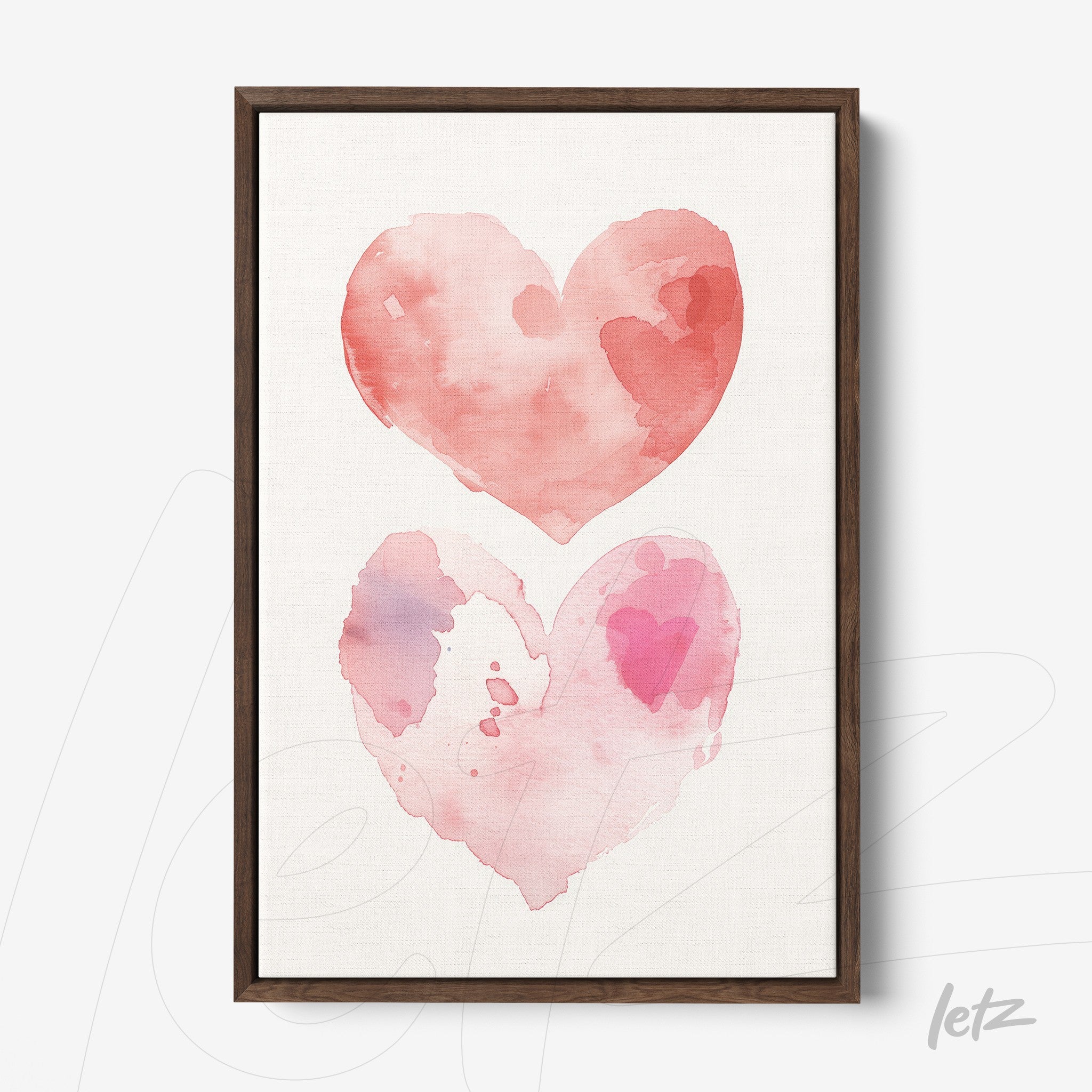 framed watercolor art featuring two hearts in shades of pink with a dark wooden frame
