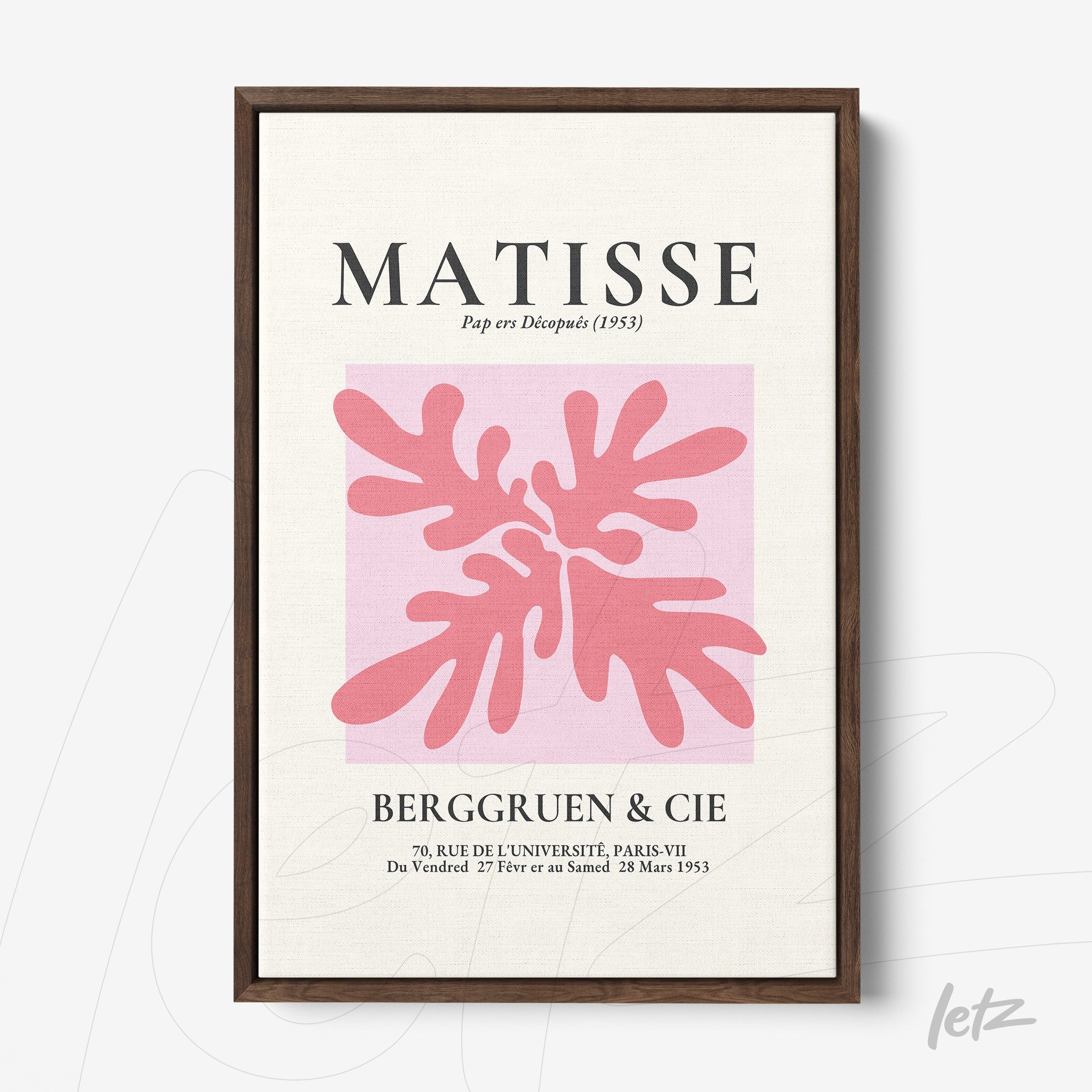 framed wall art featuring modern pink leaves design on cream background with dark wood frame