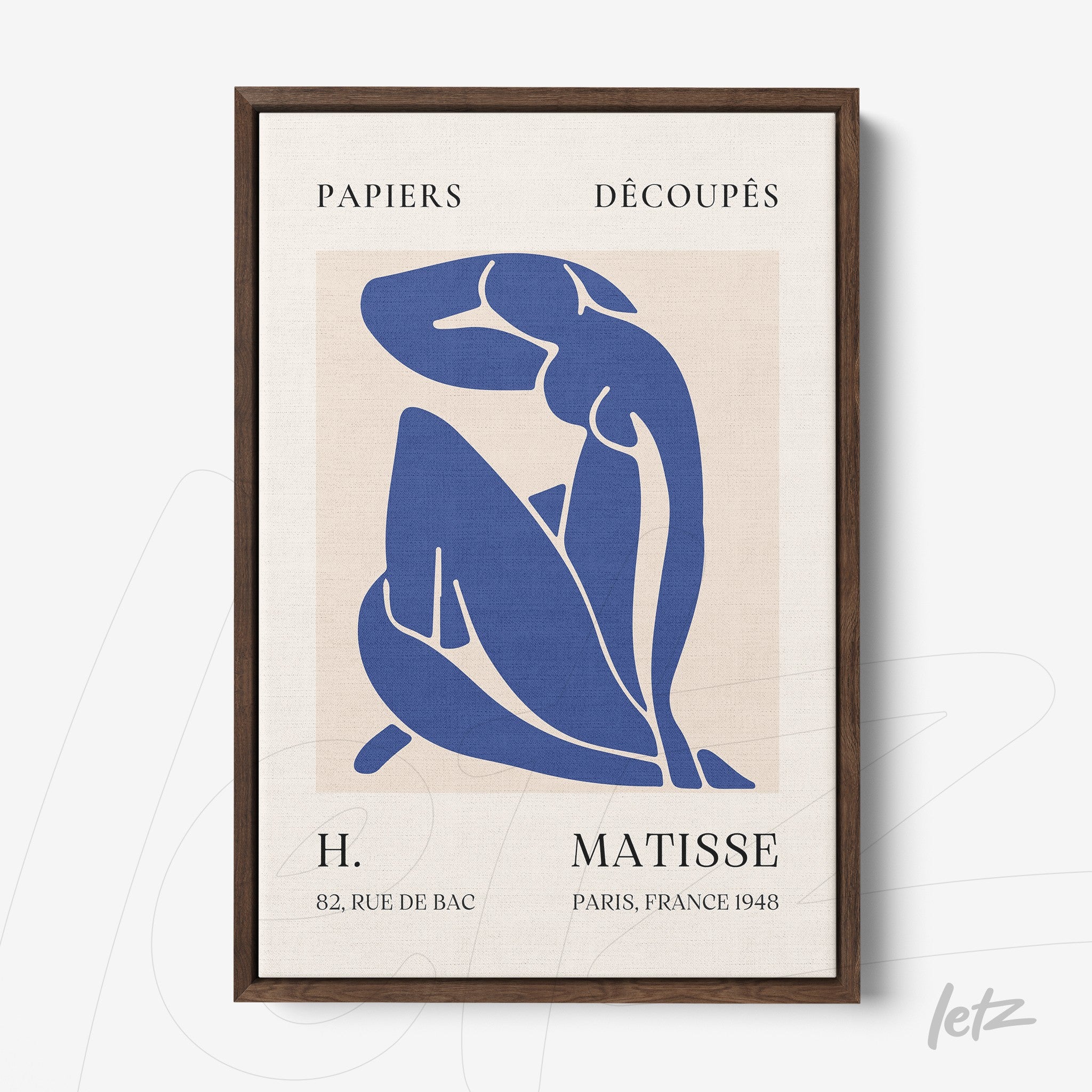 framed artwork featuring a cut-out style blue figure on a light background with dark wooden frame