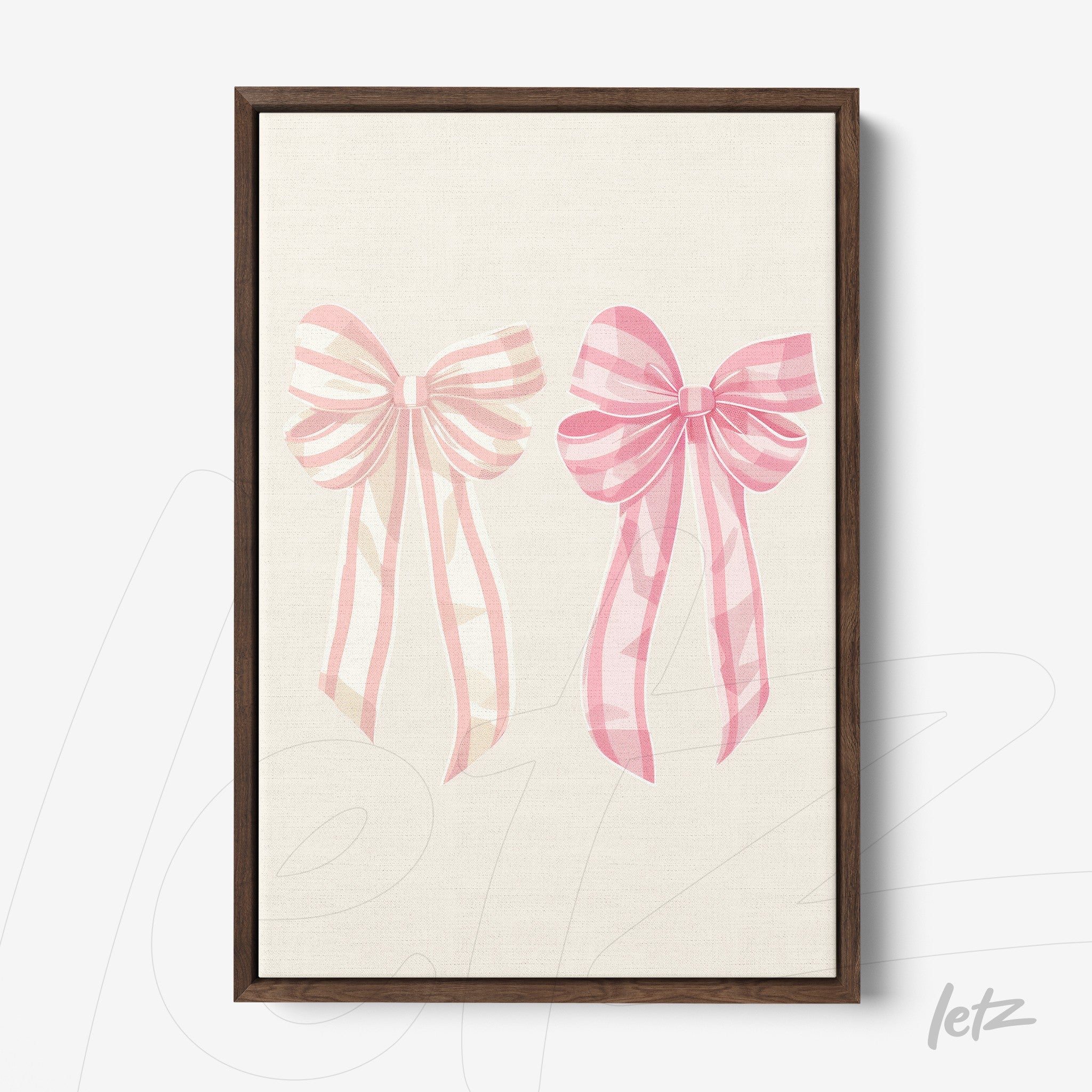 framed artwork featuring pink bows on a light background with dark wooden frame