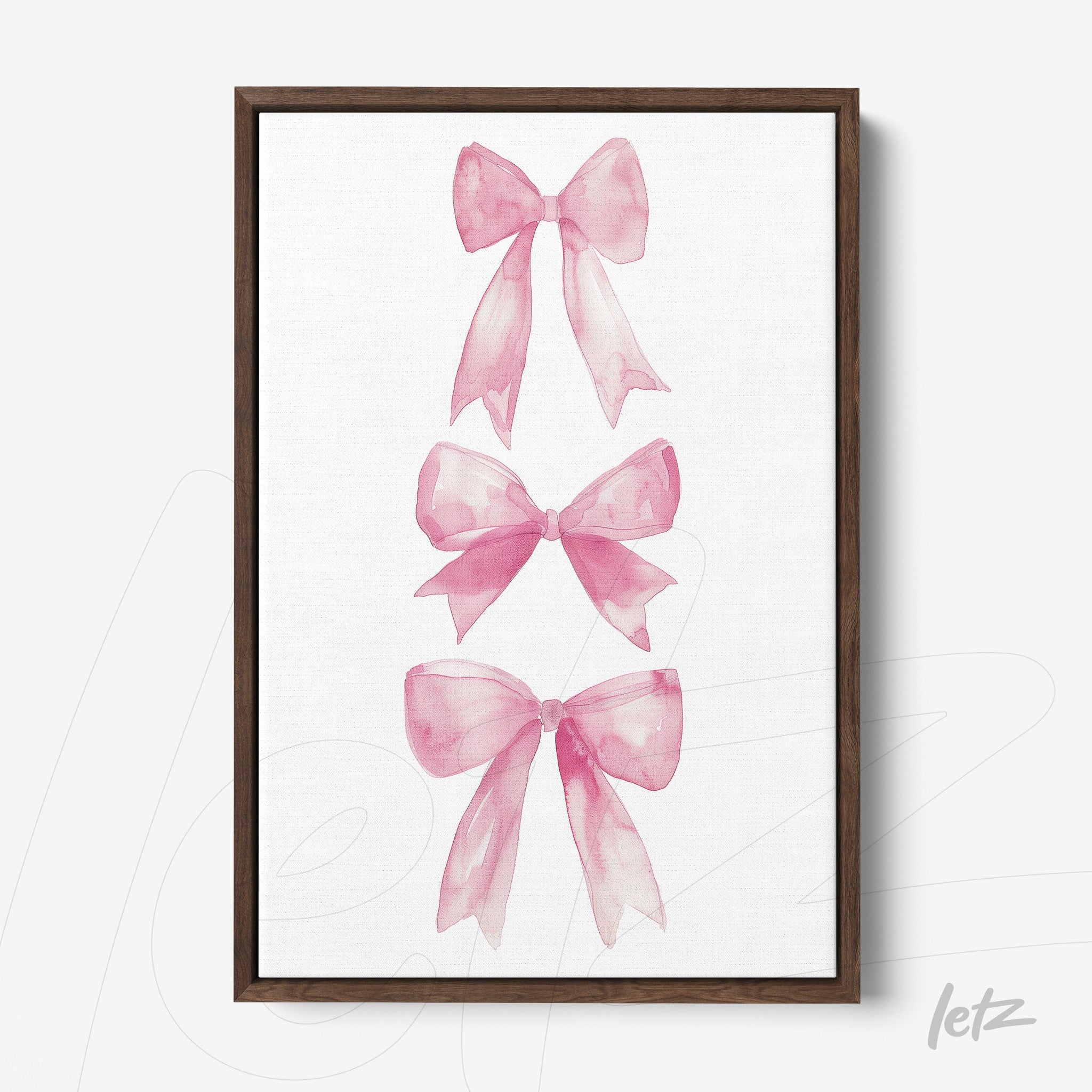 framed watercolor art featuring pink bows with a dark wood frame