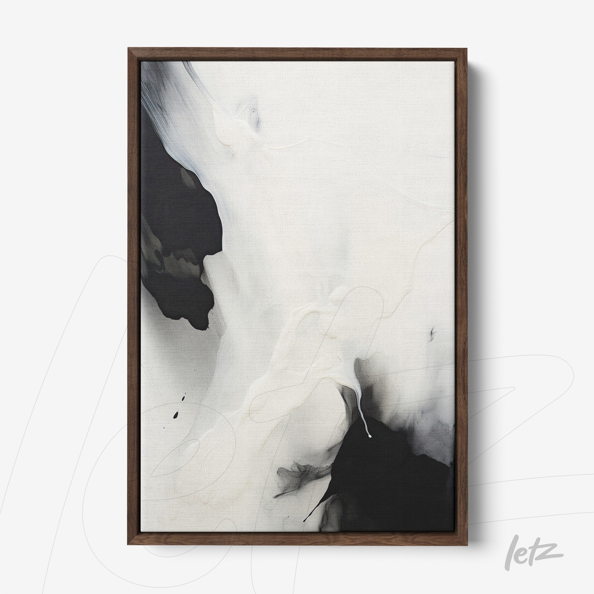 abstract wall art in black and white framed in dark wood