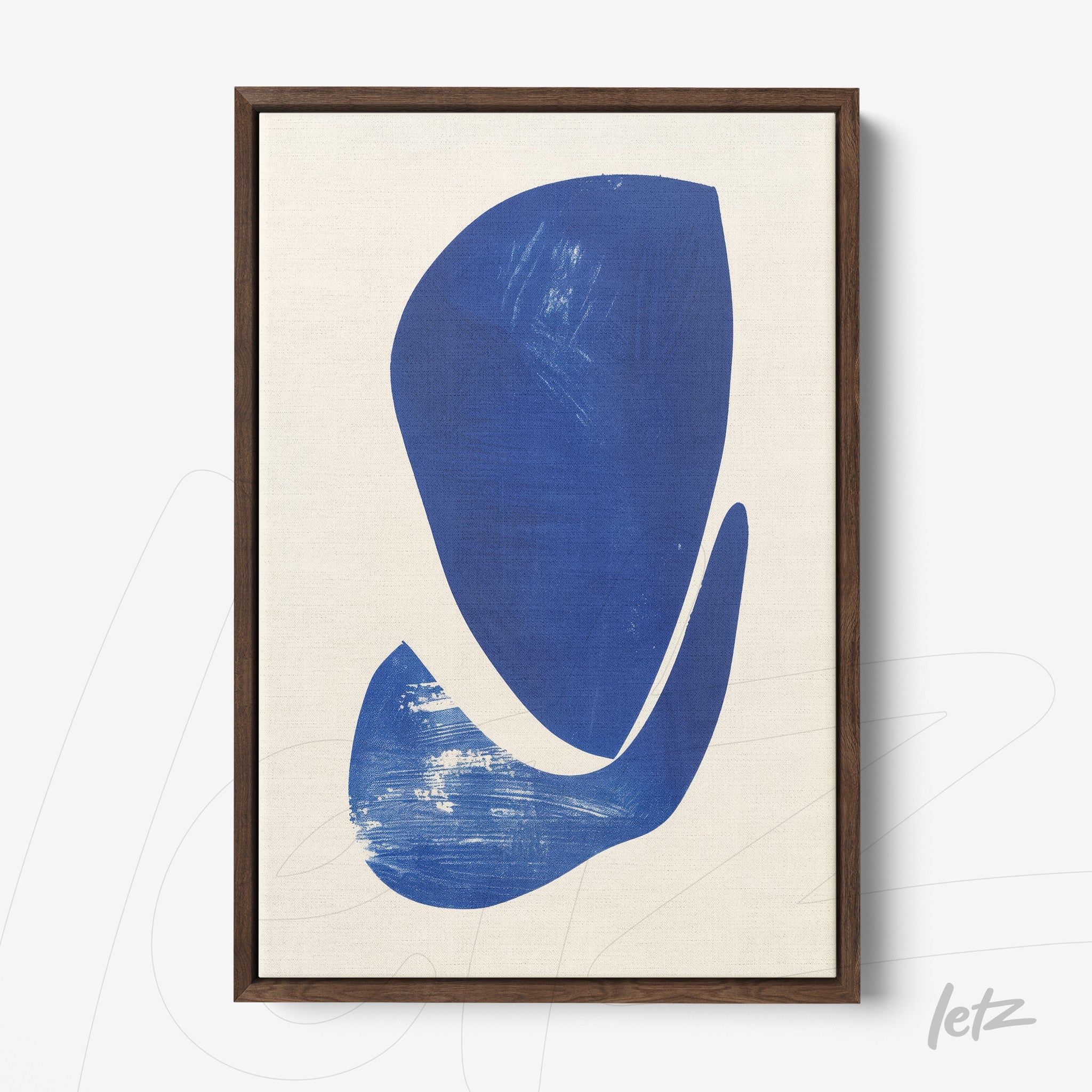 abstract art piece featuring blue shapes on light background in dark wood frame