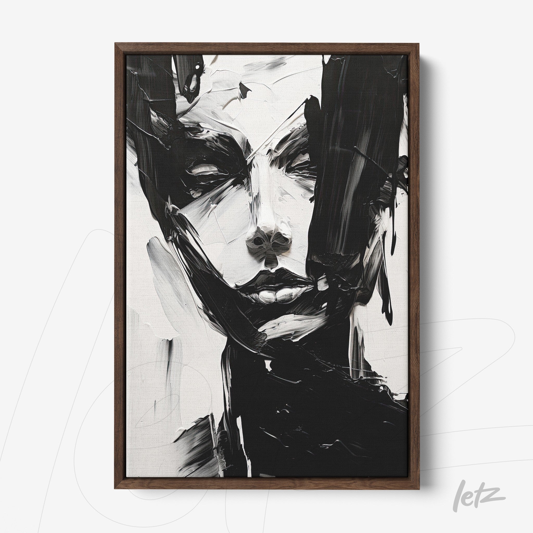 abstract portrait artwork in black and white with dark wood frame