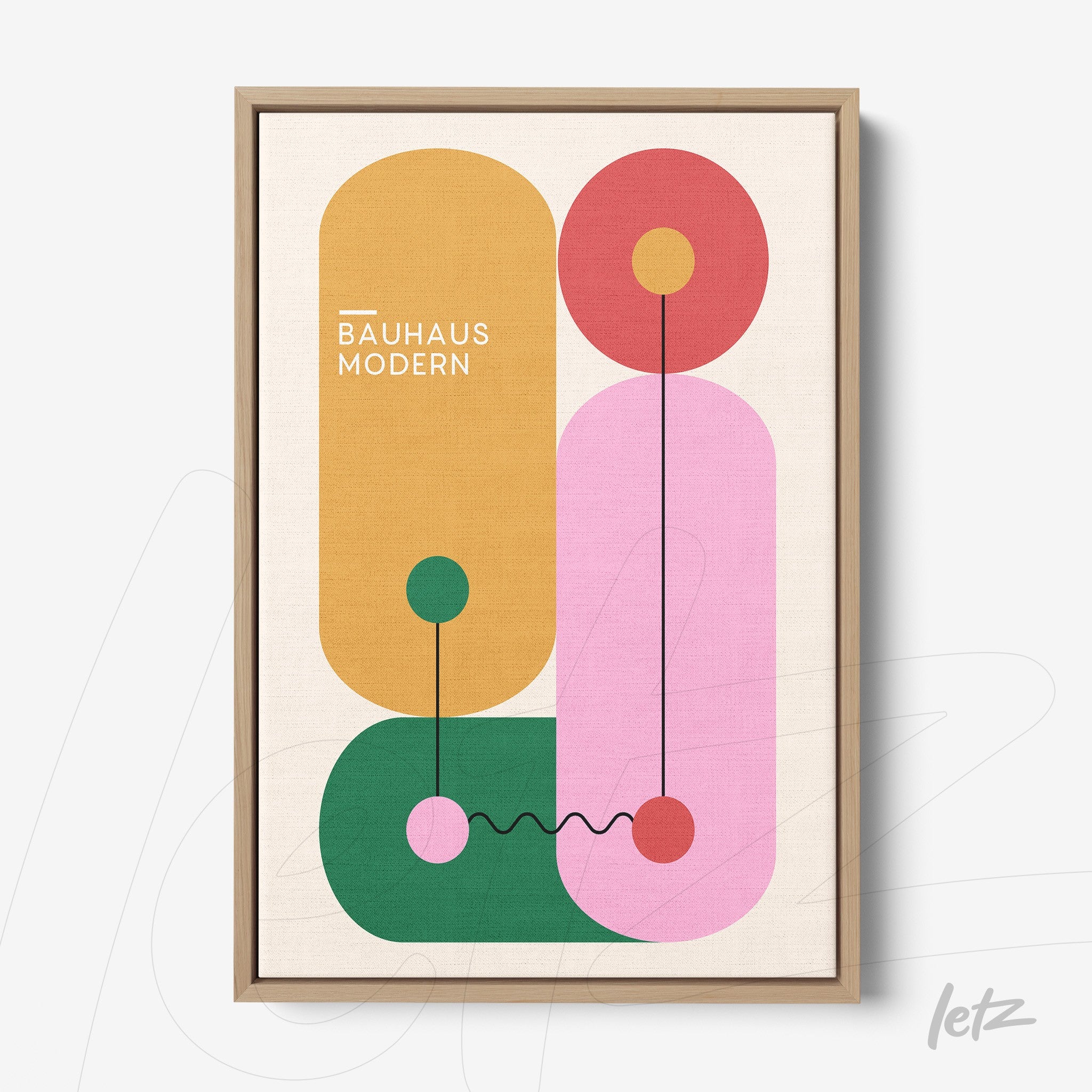 framed geometric art with vibrant colors and light wooden frame