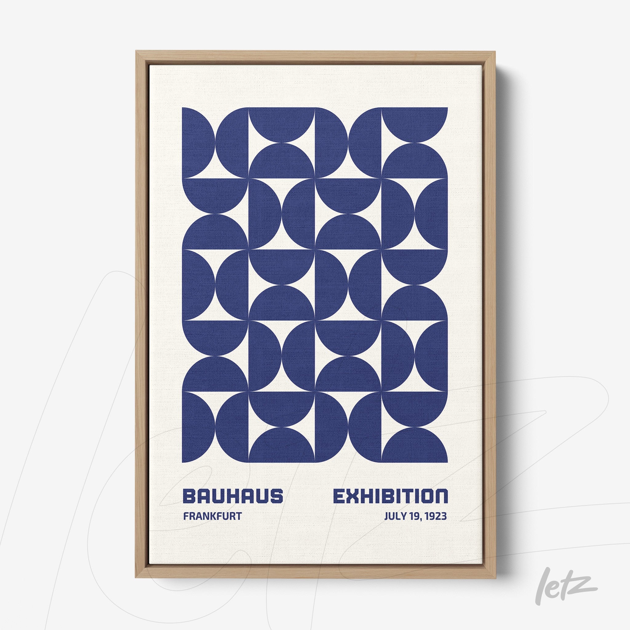 framed wall art featuring blue geometric Bauhaus style illustration with exhibition text