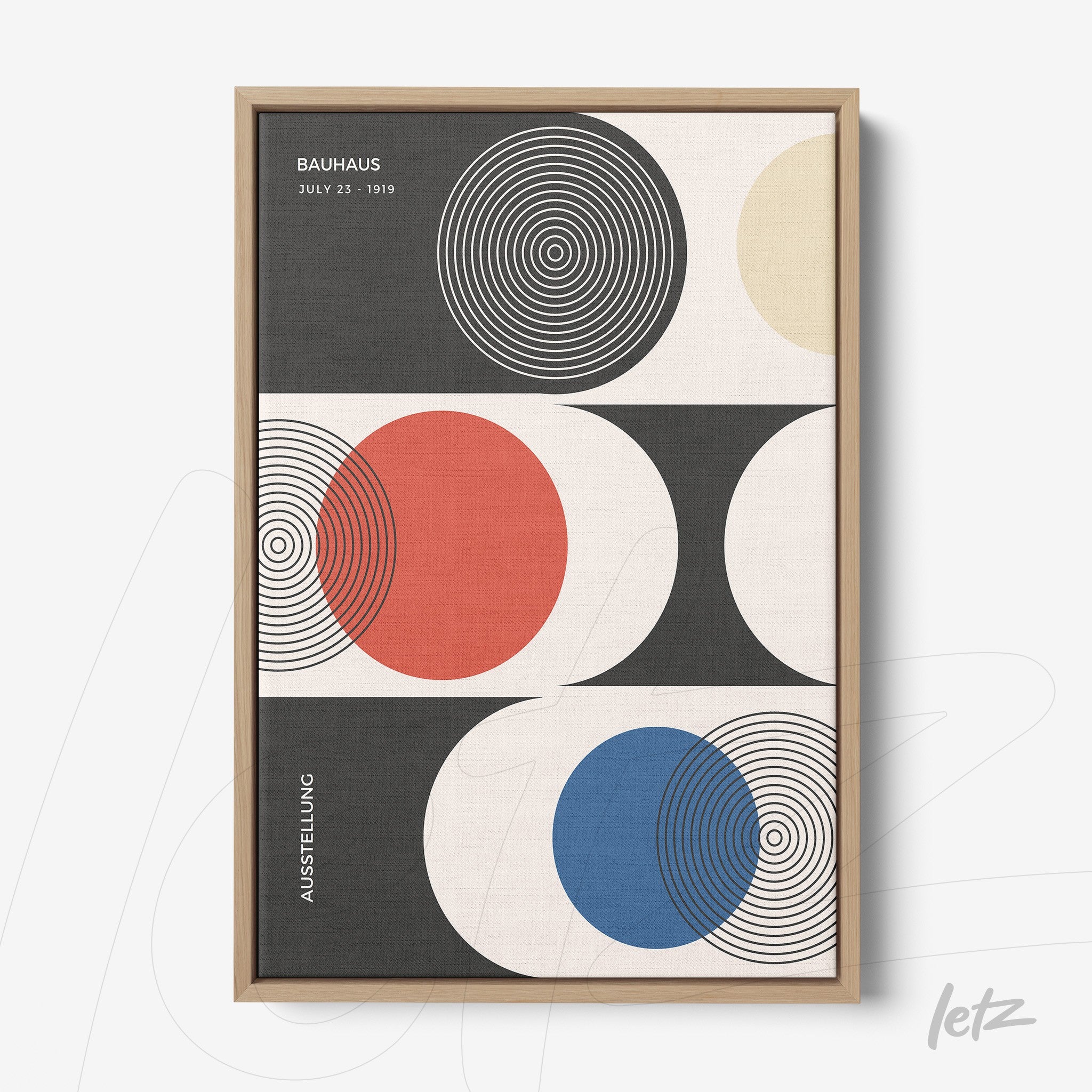 modern art print with concentric circles in primary colors on geometric background, framed in light wood