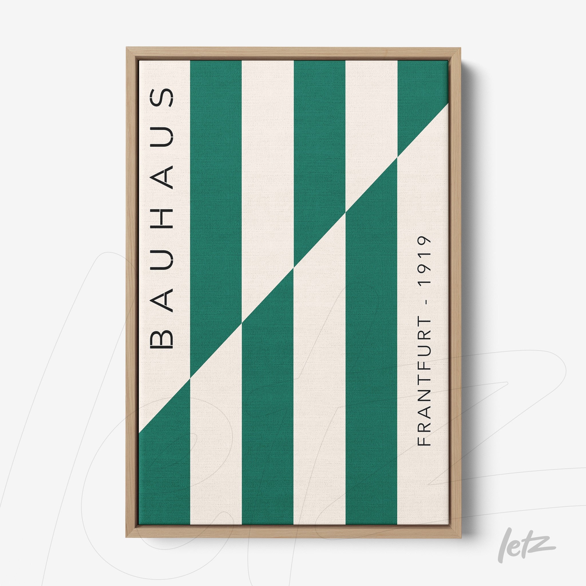 modern style framed art with green diagonal stripe and 'bauhaus' text in light wood frame
