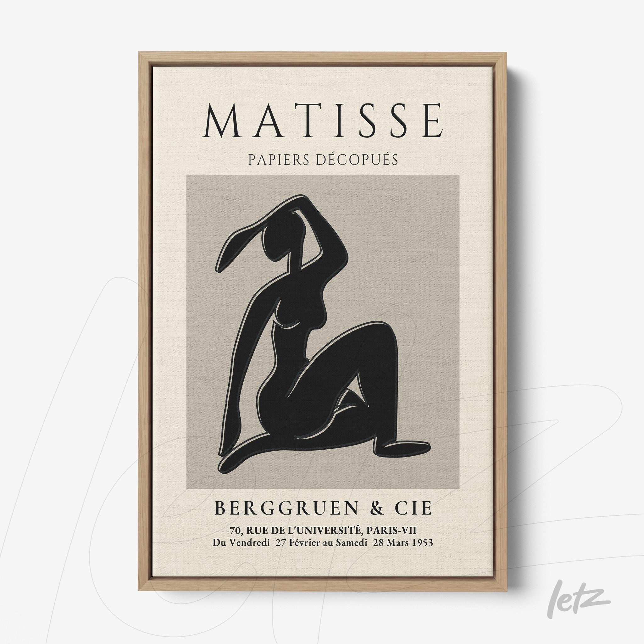 contemporary wall art featuring a black silhouette of a woman in a light wood frame