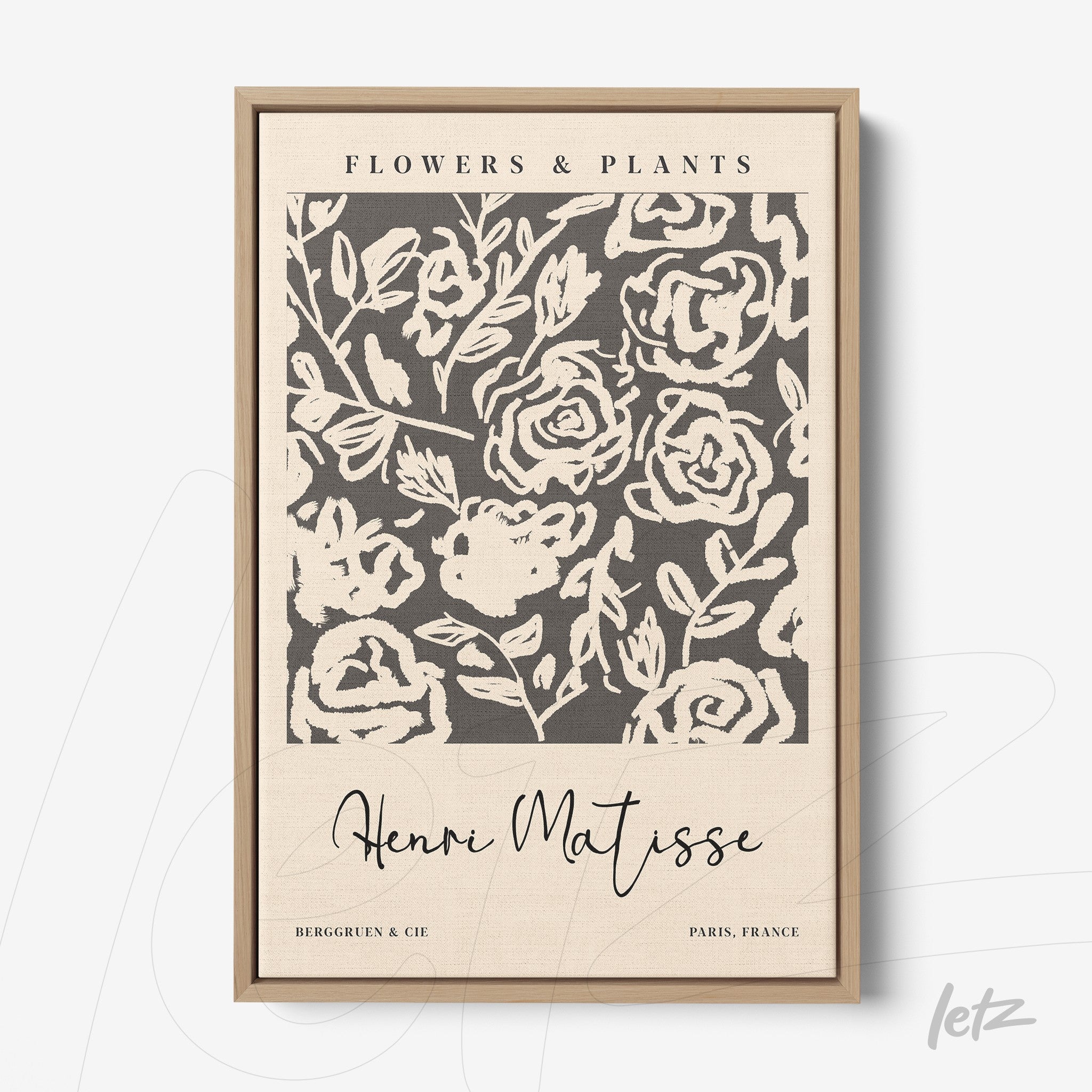 framed wall art featuring a floral pattern of dark roses on a light background with a light wood frame