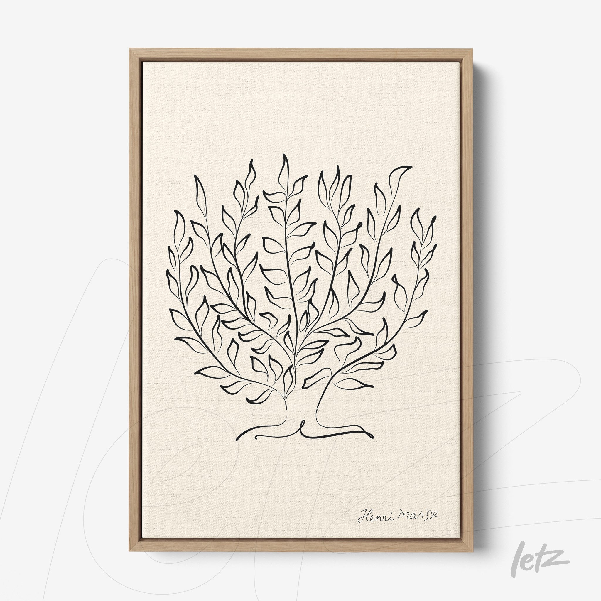 framed wall art featuring minimalist illustration of leafy plants in black outlines with light wood frame