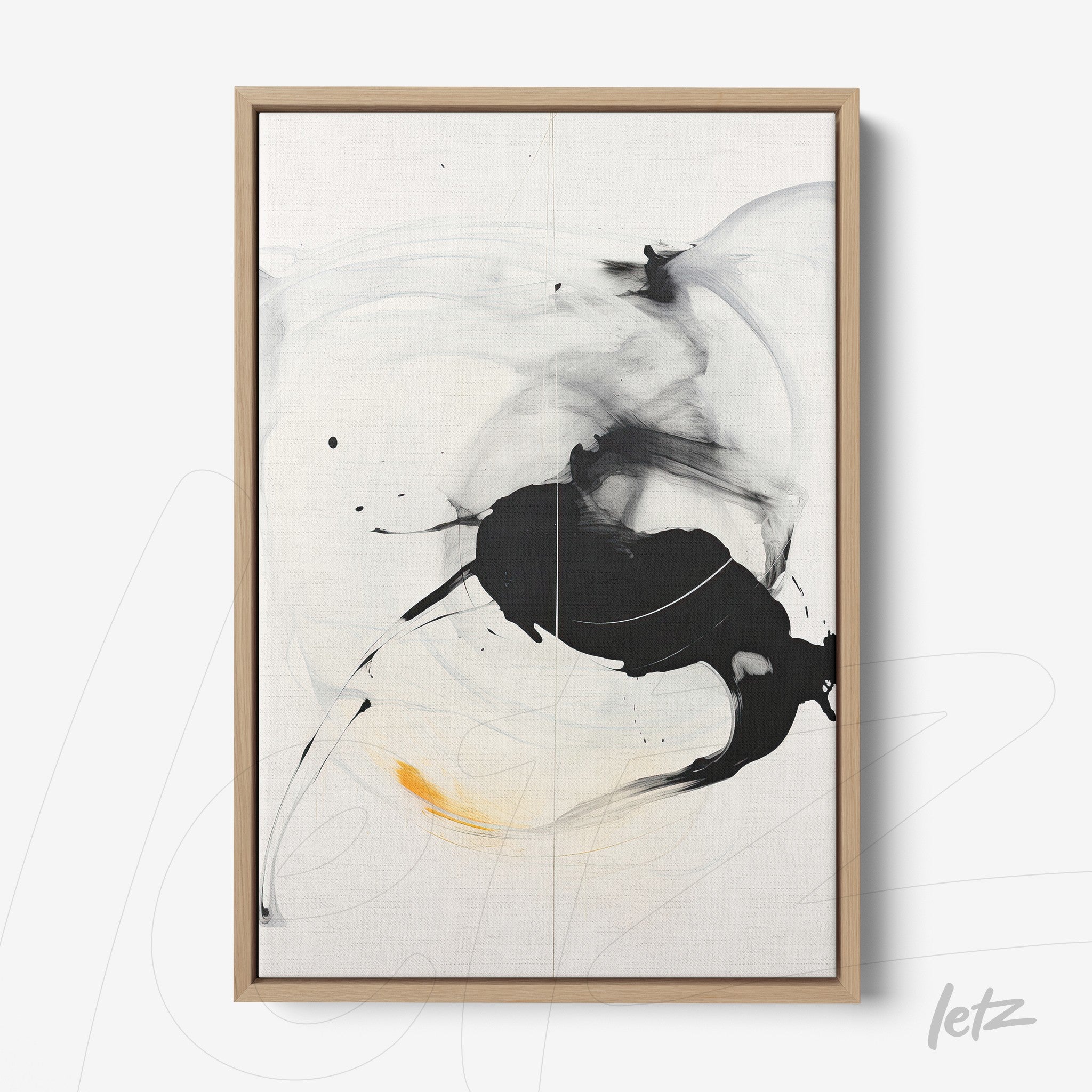 canvas artwork featuring abstract black and white design with yellow accents, framed in light wood