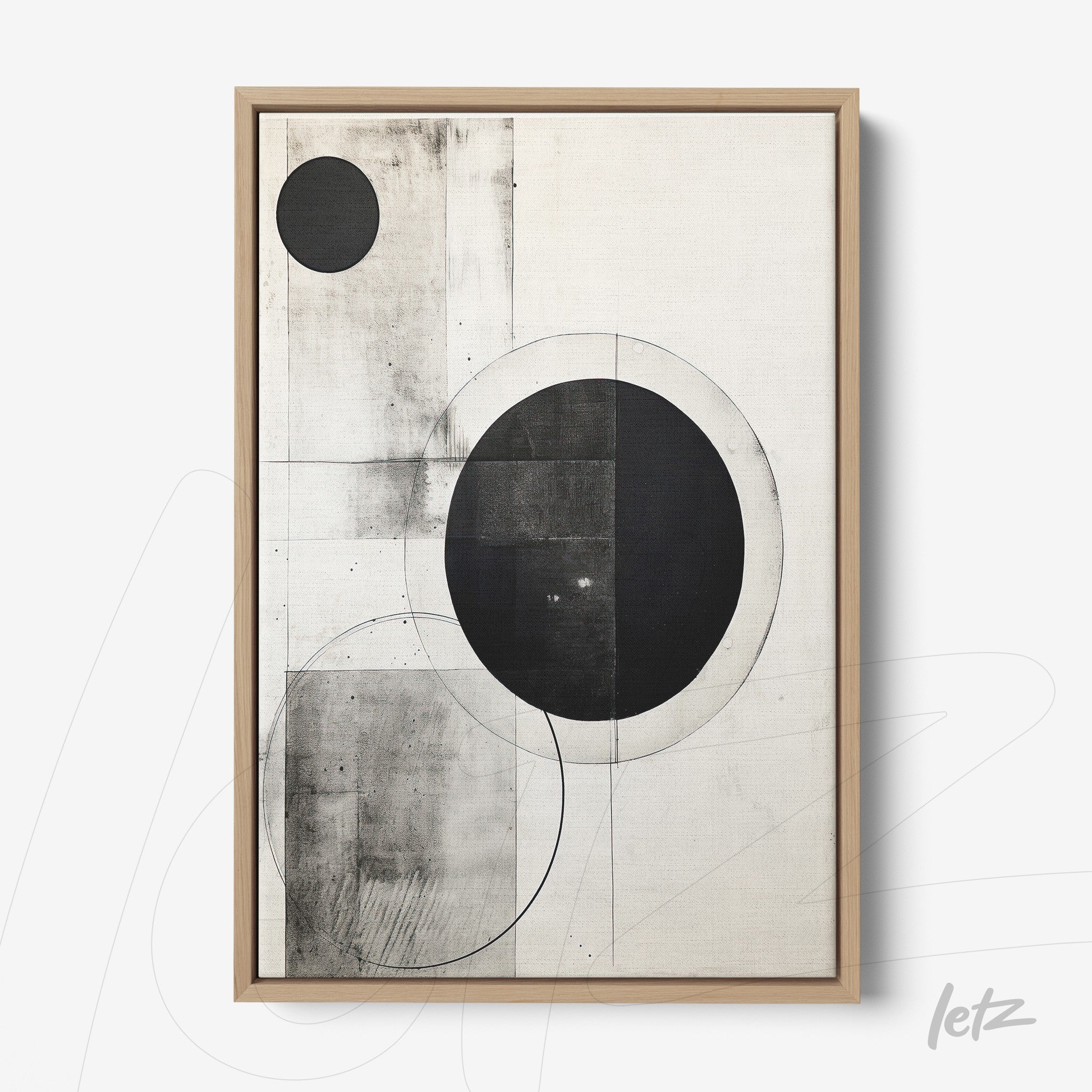 abstract wall art in black and white featuring geometric shapes like circles and squares in a minimalist composition within a light wood frame
