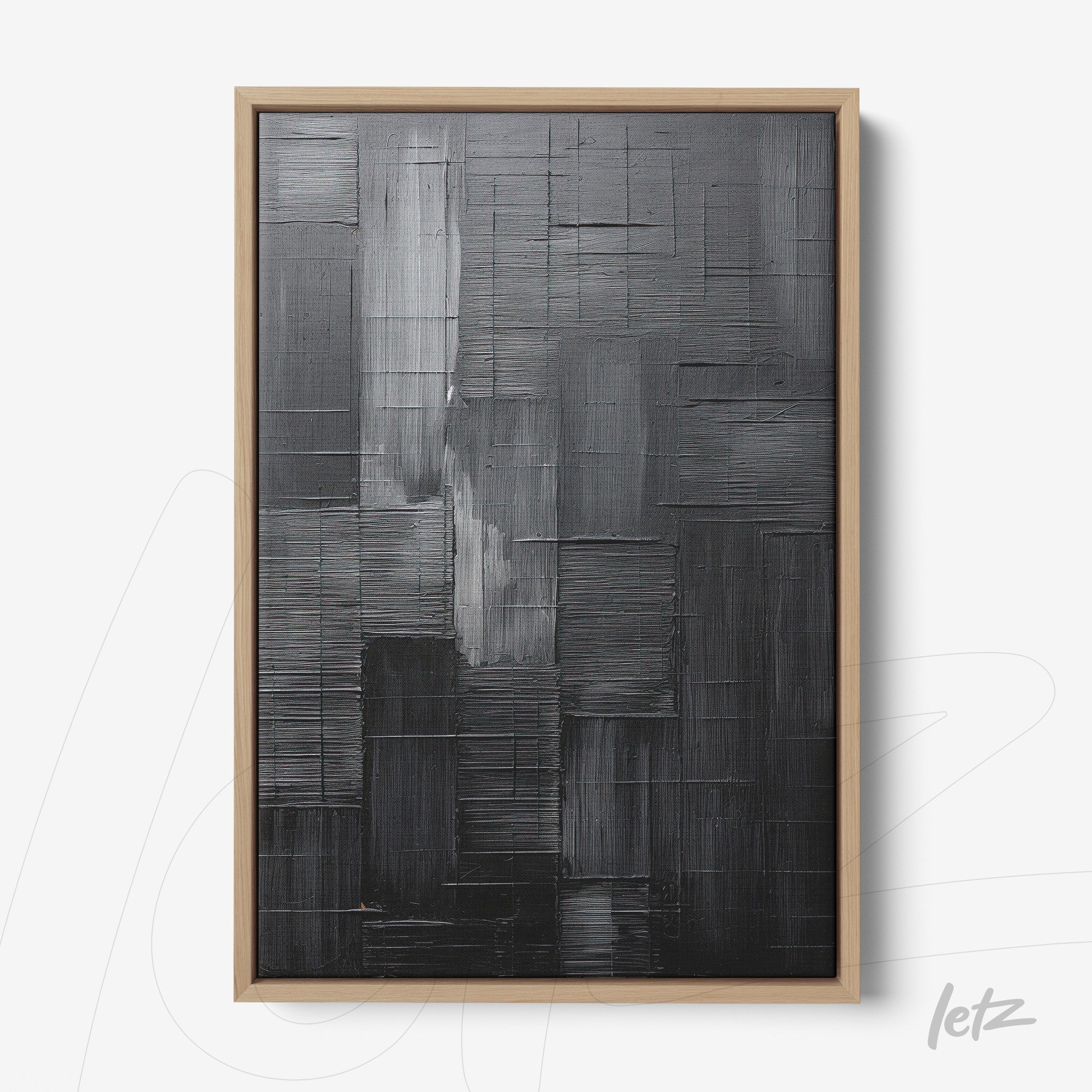abstract wall art in black tones featuring textured design with light wood frame