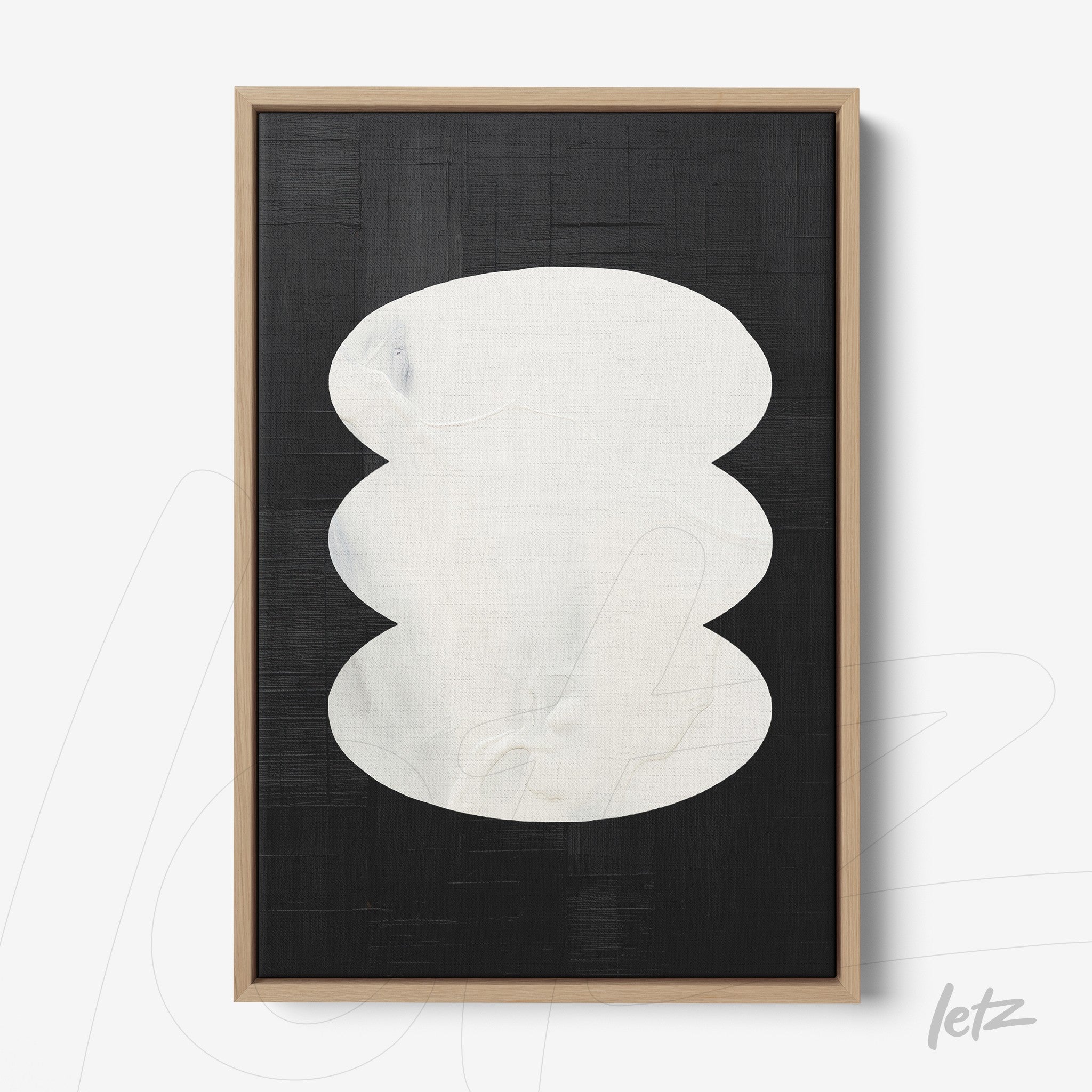 framed wall art with organic white shape on textured black background