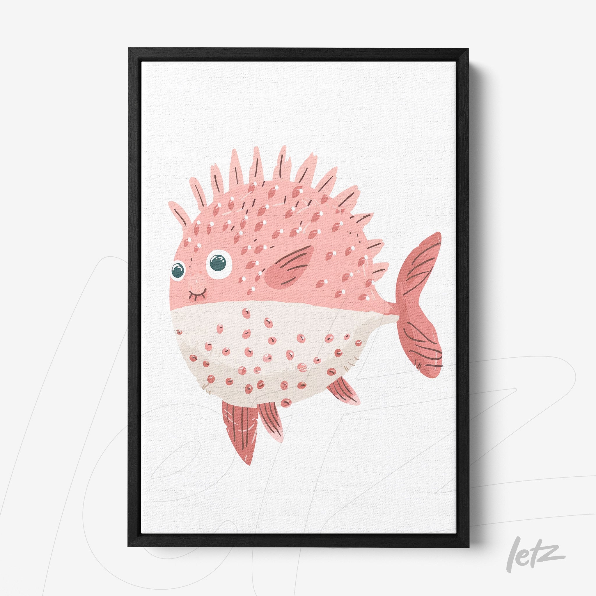 framed wall art featuring a cute pink fish with spikes and big eyes in black frame