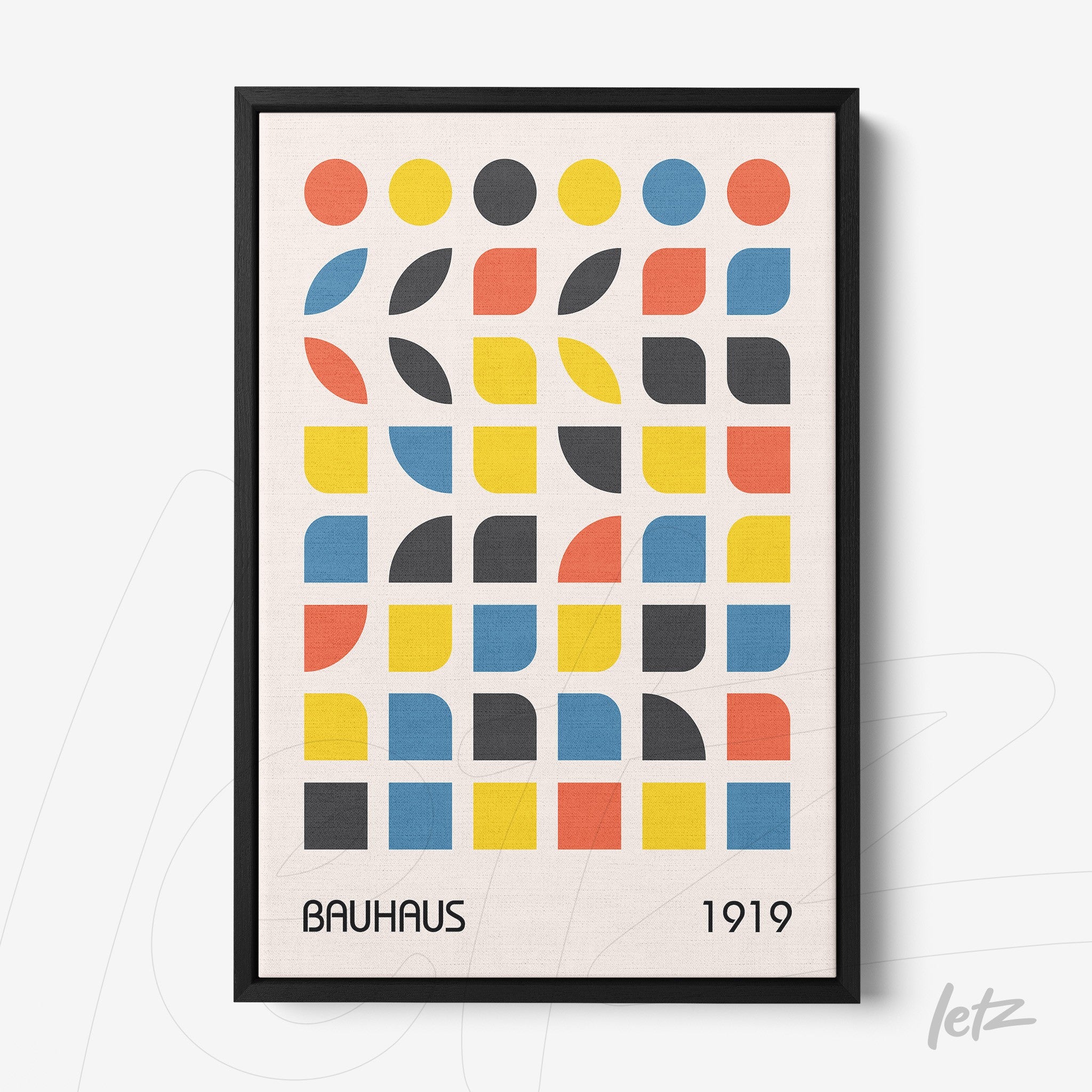 bauhaus style decorative print featuring colorful geometric shapes in a black frame