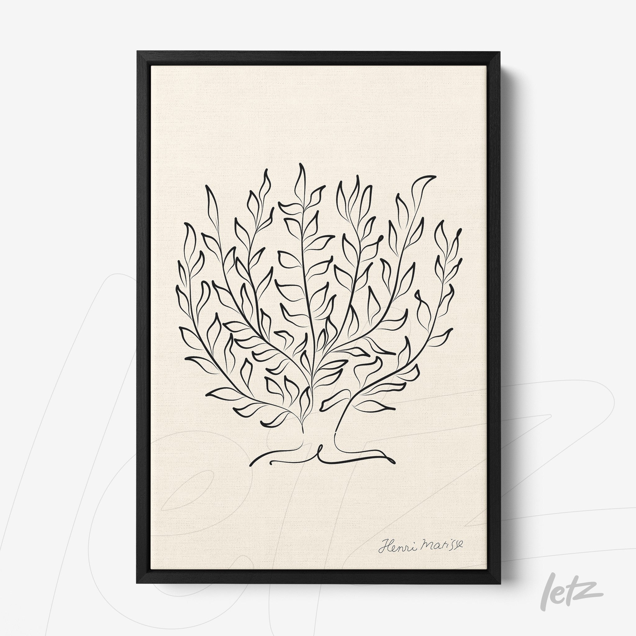 framed wall art featuring minimalist illustration of leaves in black lines on light background