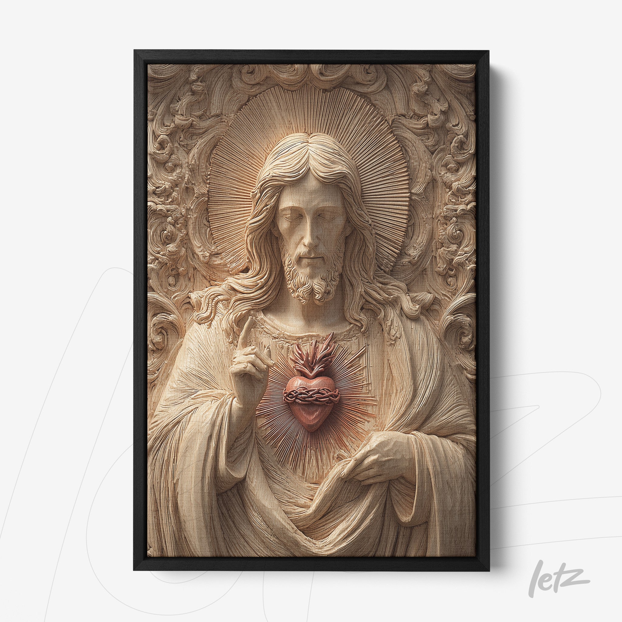 framed art print of sacred heart of Jesus in relief with a black frame and light background