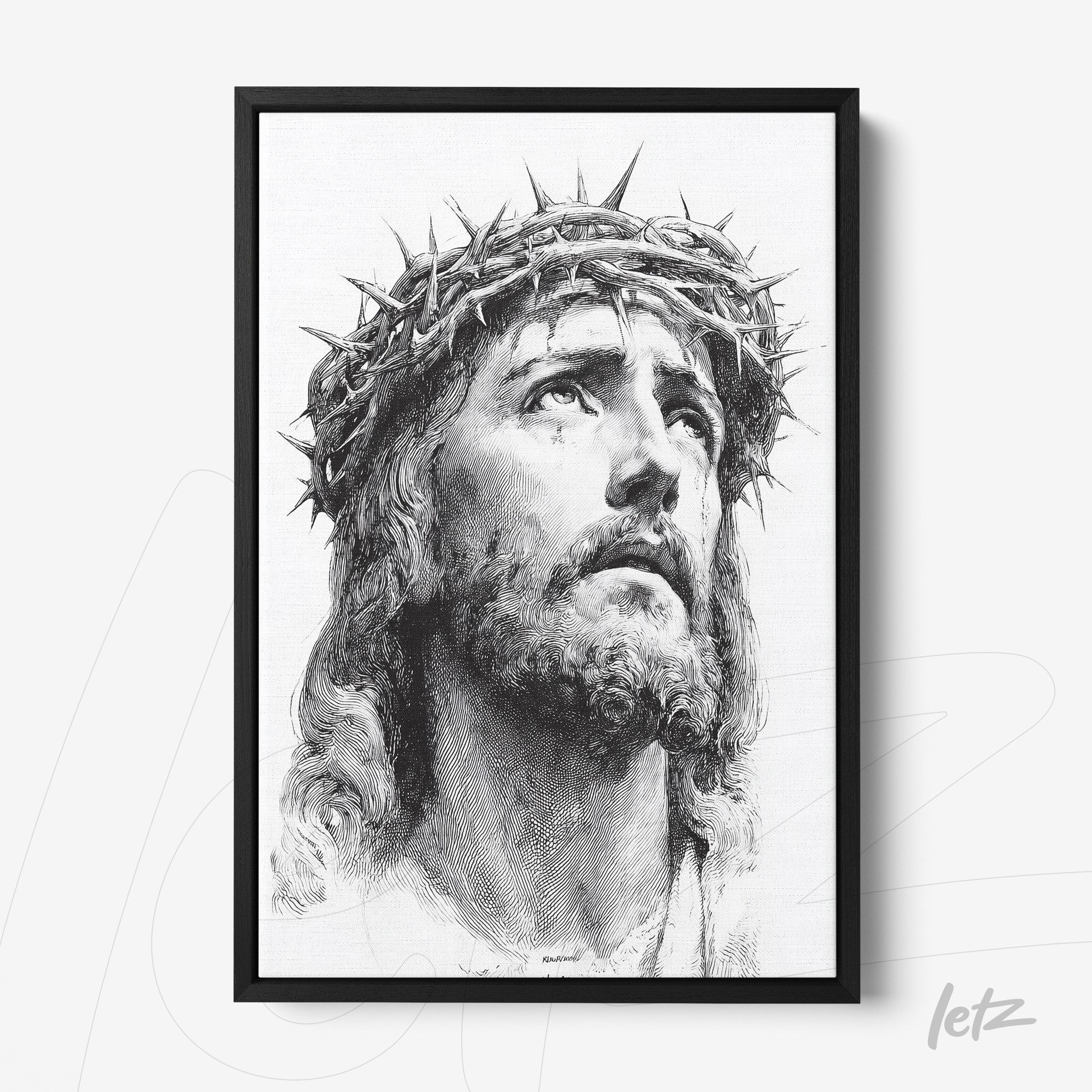 framed artwork featuring a black and white portrait of Jesus Christ wearing a crown of thorns