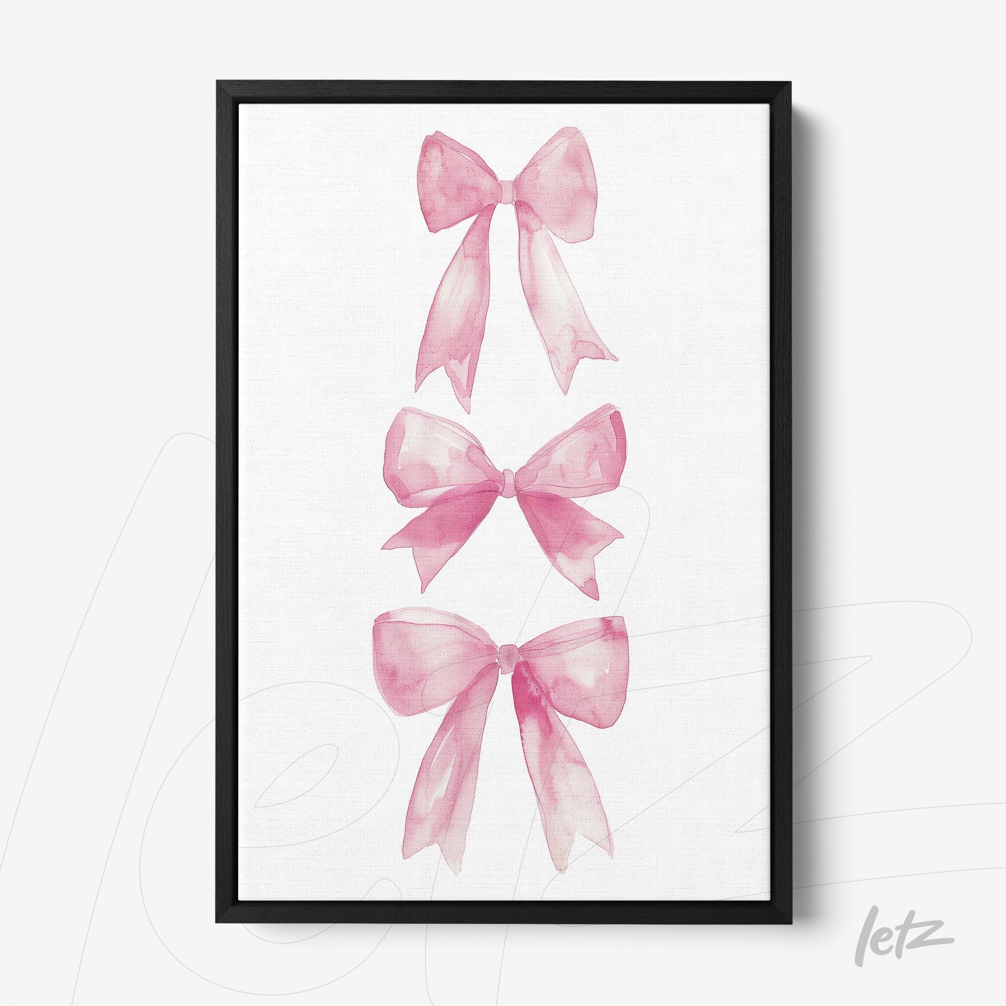 framed wall art with watercolor illustrations of pink bows in black frame