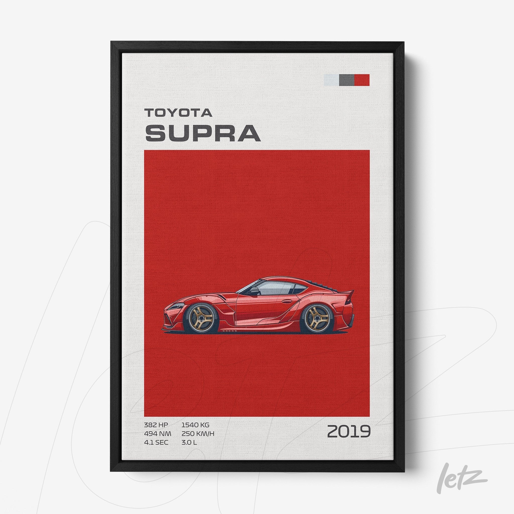 framed wall art featuring a stylized illustration of the Toyota Supra on a red background with a black frame