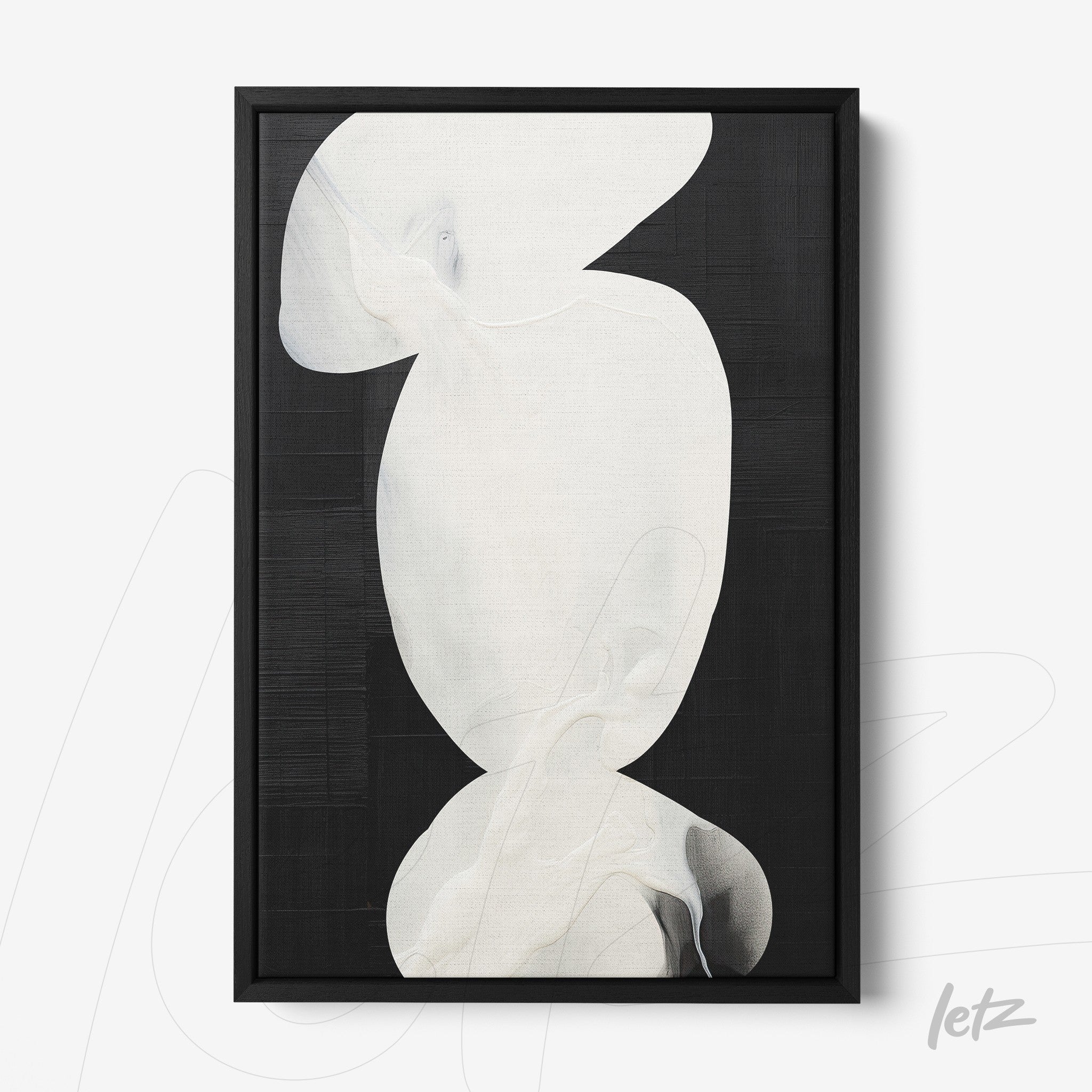 framed art featuring abstract shapes in white on a black background with a black frame