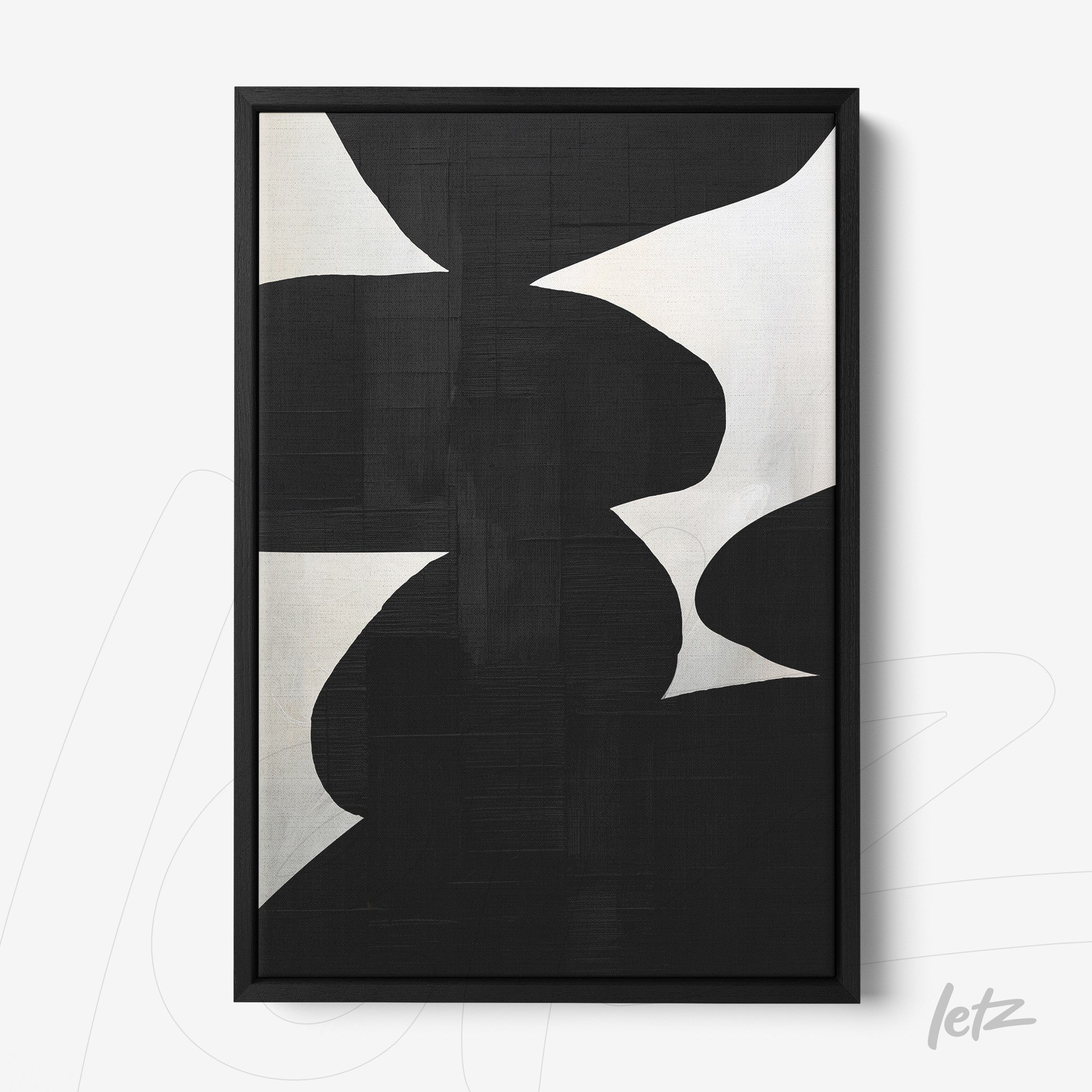 modern artwork featuring abstract black and white shapes in a thin black frame